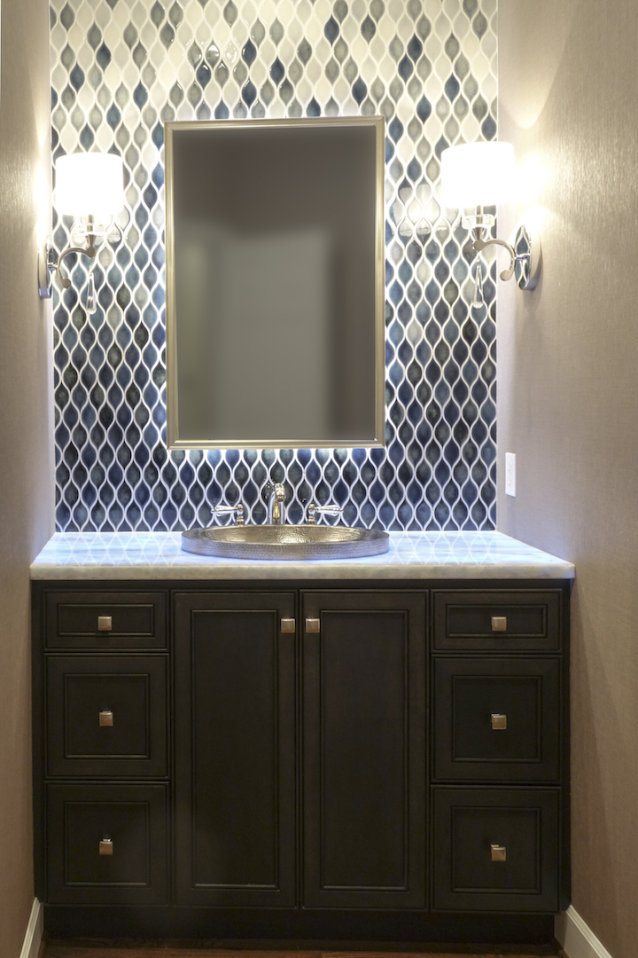 A beautiful Powder bath with exquisite details like handmade tiles, which fade from light to dark...