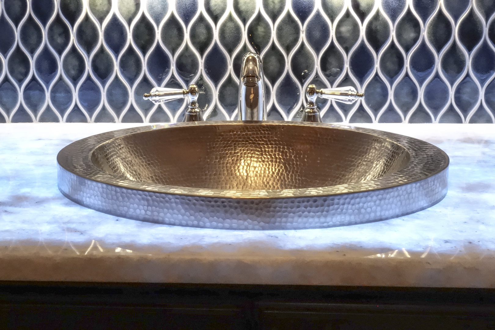 And a handmade hammered copper nickel plated sink...