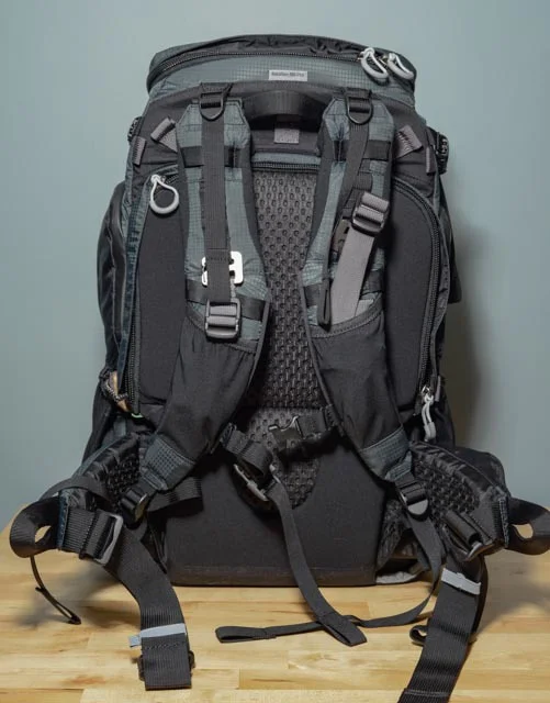 The shoulder strap assembly has several adjustment points, allowing for almost custom fit on this bag. In this photo I also have the rigging for the optional tripod mount attached (the carabiners on each shoulder strap). The back pad also has a nice mesh panel to help keep you cool. 