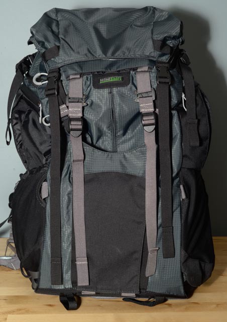 This is the tripod cup for those who wish to mount a tripod to their back. This is a gizmo I'll probably never use as intended -I will either mount it to my side using that mesh pocket or use their tripod mounting system to carry it. However, this pocket will be a great place to stash a coat!