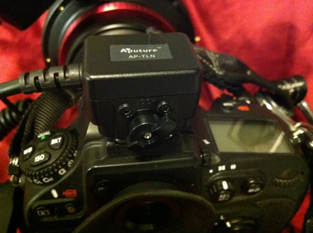 The TTL cable attached in the camera's hot shoe