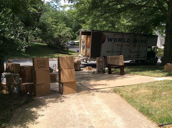 Movers staged all of the boxes, weighing over 7,000lbs, outside before loading them into the crates. It took almost 2 trucks to carry all of those boxes away!