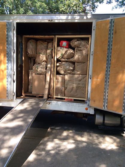 In a crazy game of Tetris, the movers managed to stuff all 208 separate boxes & pieces into these wooden containers. The crates are designed to load straight into a commercial shipping container for maritime shipment to the UK.