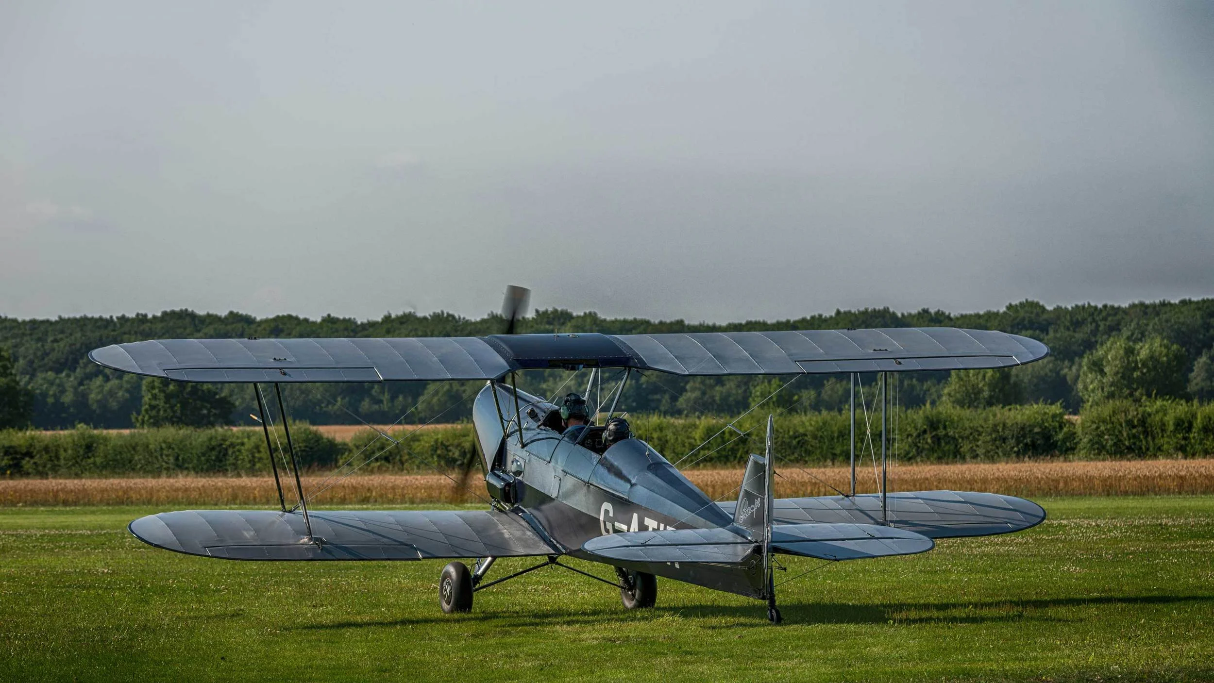 The Stampe taxiing towards the grass airstrip at the Little Gransden airfield. It flew for about a hour today, offering its passengers some breathtaking views of the British countryside.