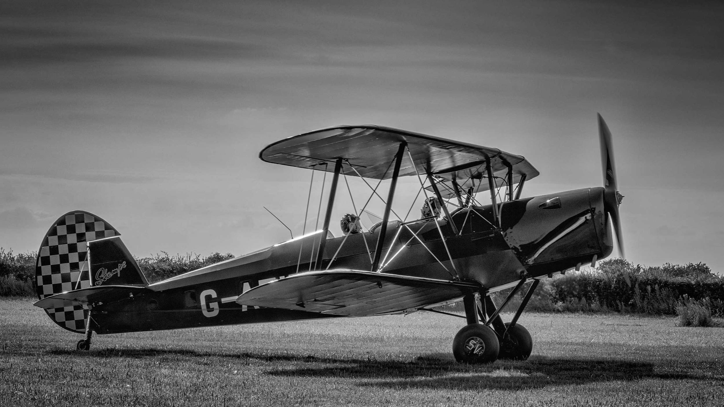I usually find that aircraft photographs either look better in black and white or color, based on the personality of the aircraft and story I'm trying to tell.... but this Stampe is the exception and looks gorgeous in both!