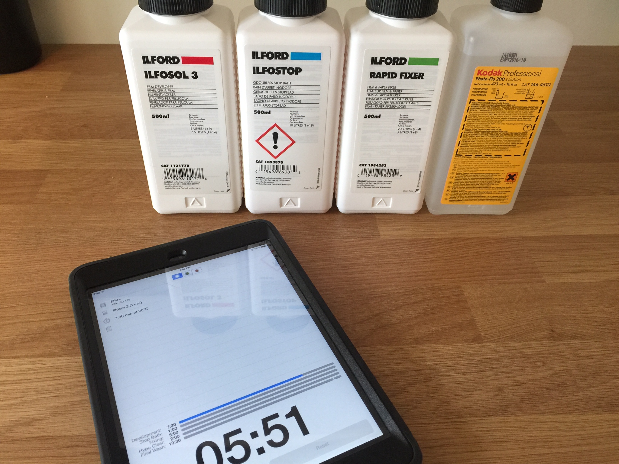 The chemistry used to develop these test rolls. From left to right: Developer (Ilfosol 3), Stop Bath (Ilfostop), Fixer (Rapid Fixer) and Kodak Photo Flo. Again, note the MassiveDev app for iPad.