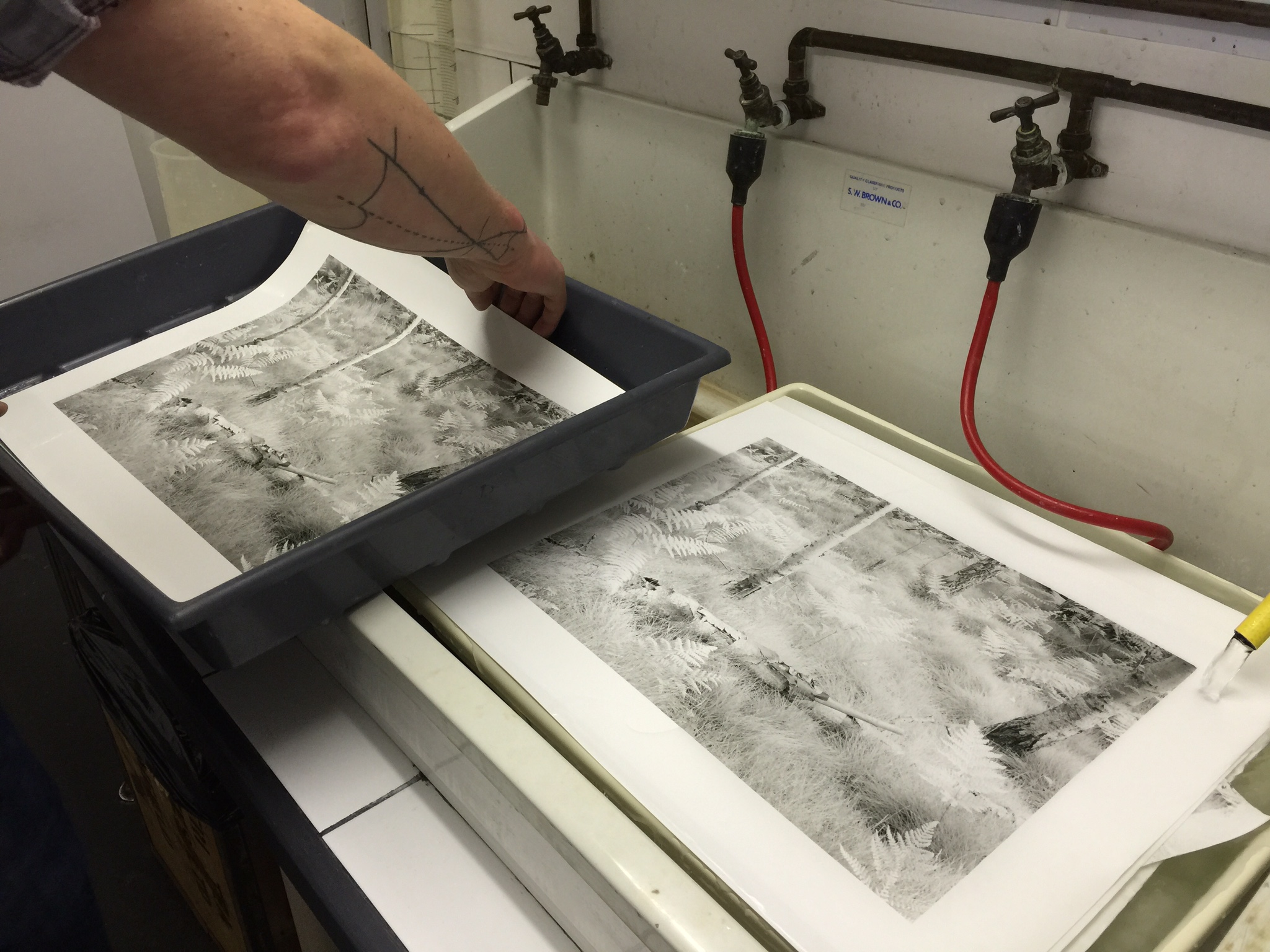 Looking at some of the prints John made under our watch. Although it's a basic iPhone photo, you can still tell the difference in tonality between the two prints, which are made from the same negative.