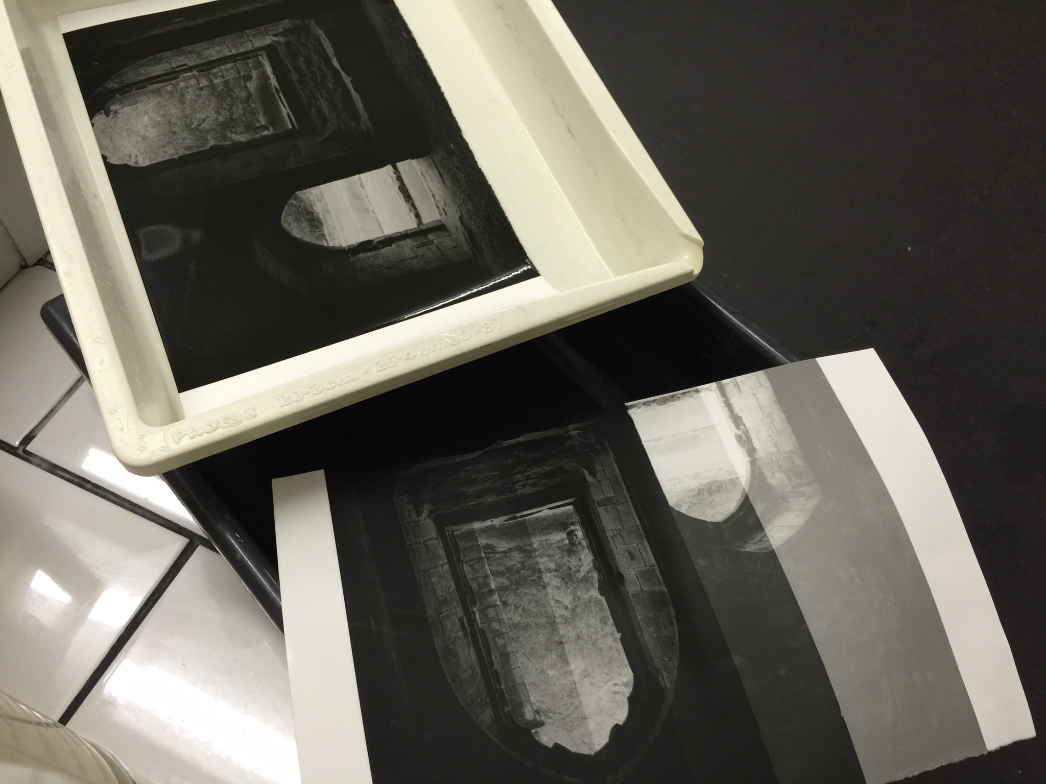 More test strips! The bottom one helped me determine that between 13-15 seconds was the proper exposure. The one in the white tray is a side by side of 13 and 15 seconds to compare those exposures more closely.