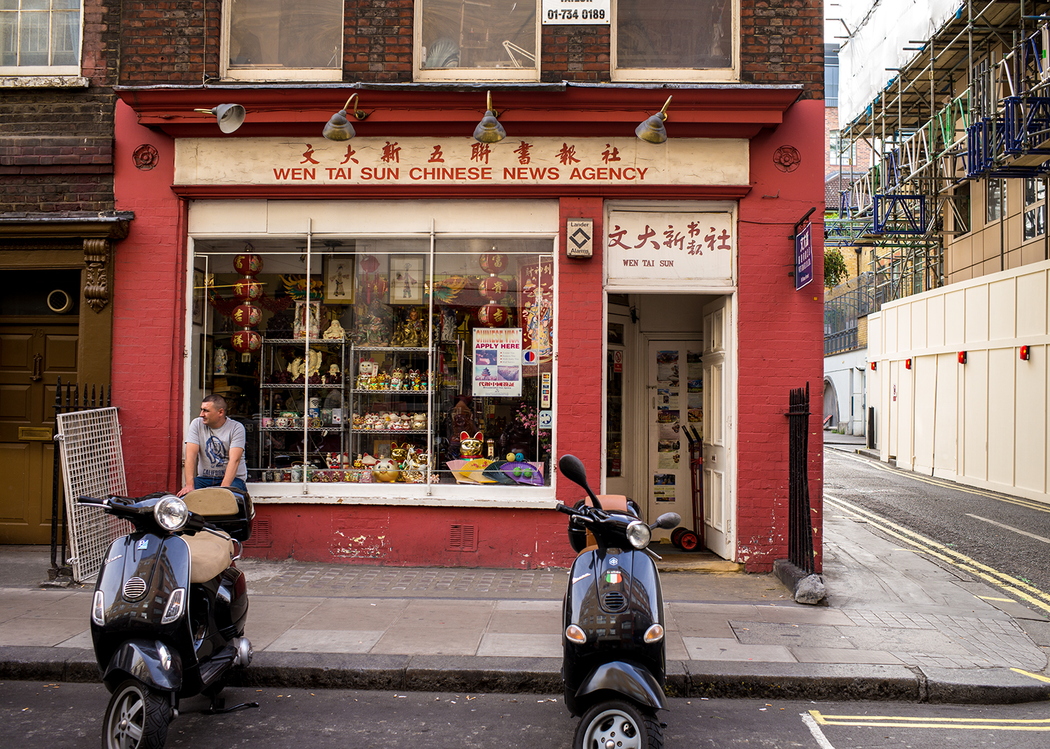 A Chinese News Agency Shop - I liked the bright red color and was curious to see how it rendered. I think the result is very pleasing. Notice how there's no vignette on the photo - that's the Leica optics at work!