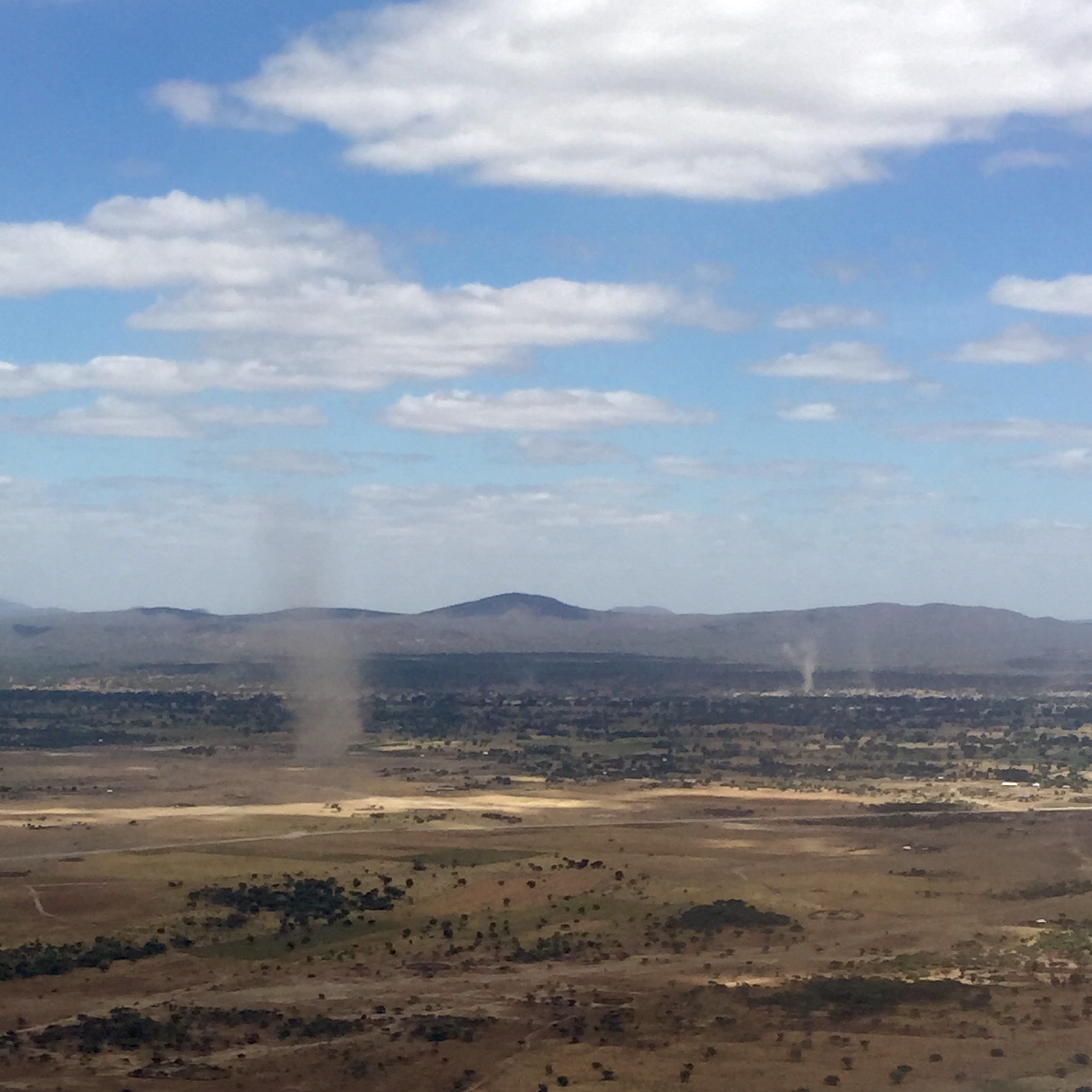 Sand / Dust / Dirt devils as seen from the airplane on our approach into Kilimanjaro Airport
