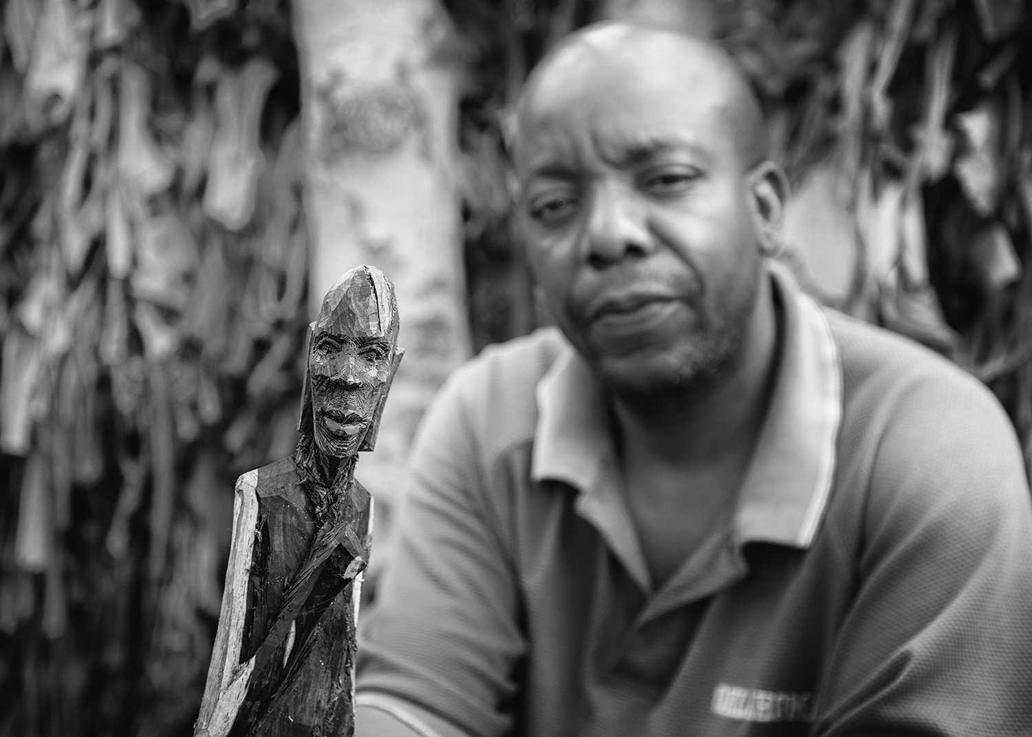This man carves ebony figurines to make money to feed his family