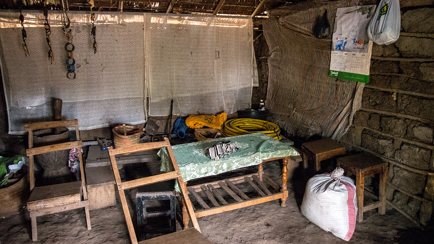 Inside one of the houses of a local - this isn't a museum, this is a real person's home. The house is made from cow dung and has no electricity or running water. The roof leaks and needs repair every few weeks.