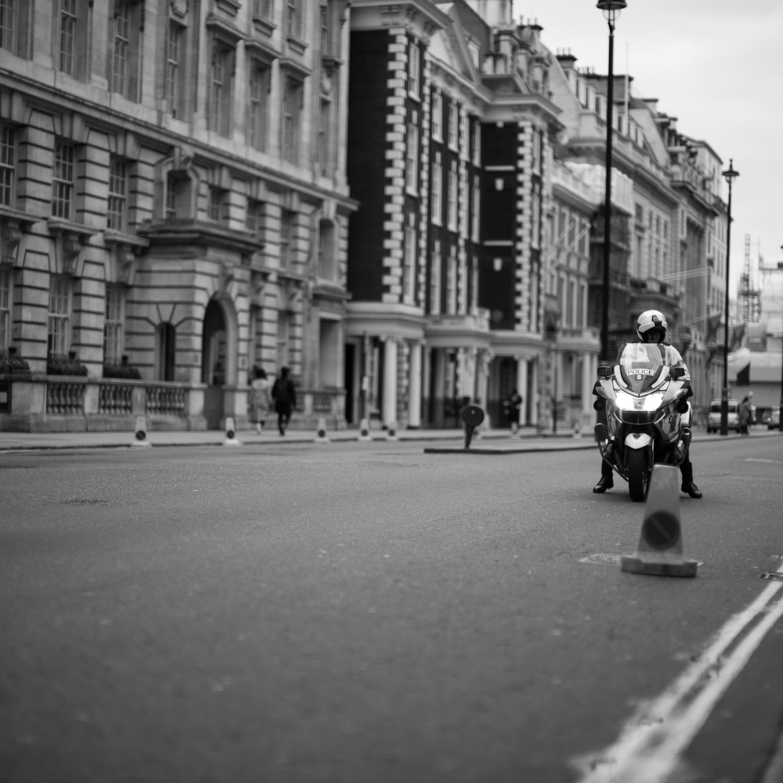 A London traffic police officer closes the road to Trafalgar Square awaiting protestors