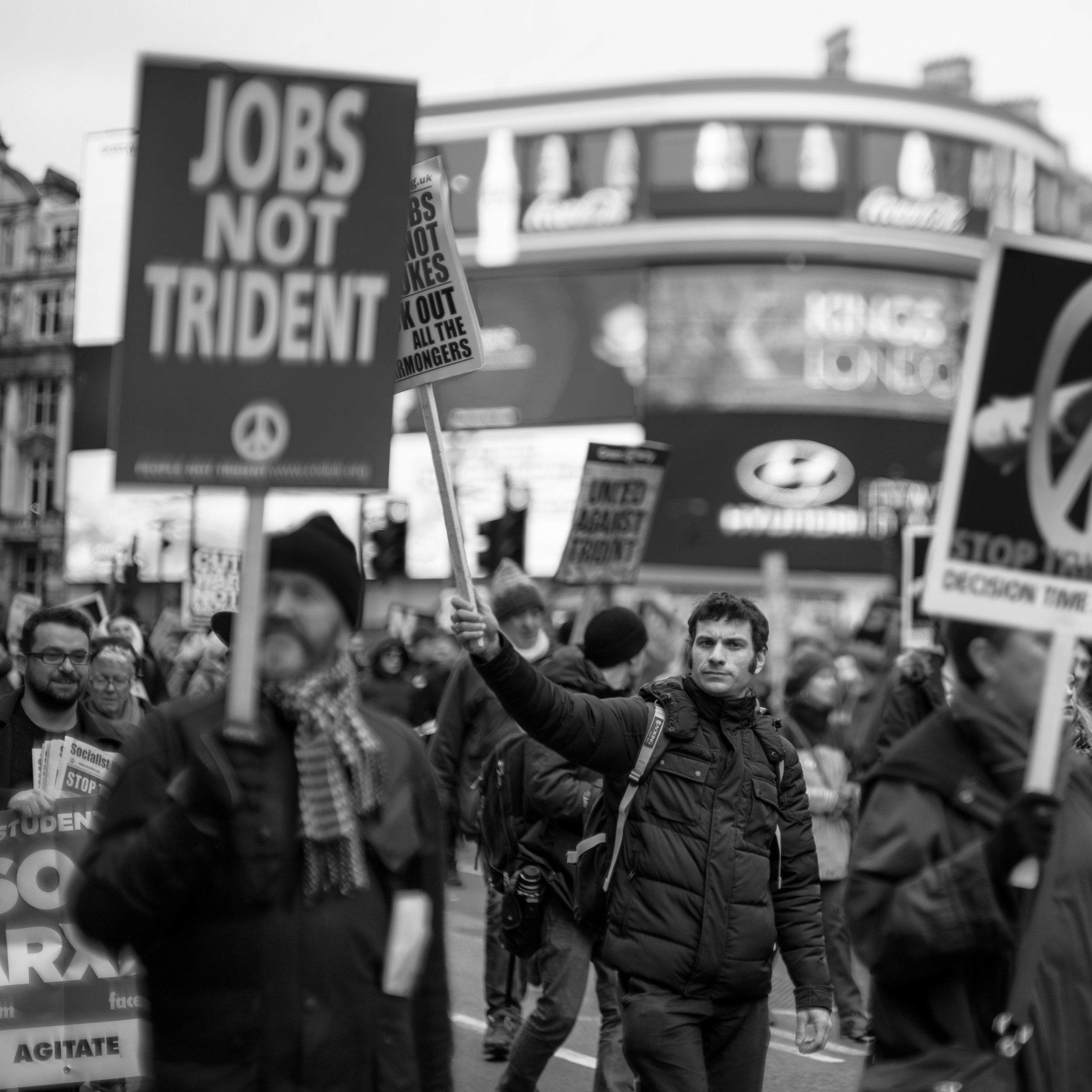 The Noctilux is a great storytelling lens. Here it isolates just this one protestor, while telling the story about the size and scope of the protest.