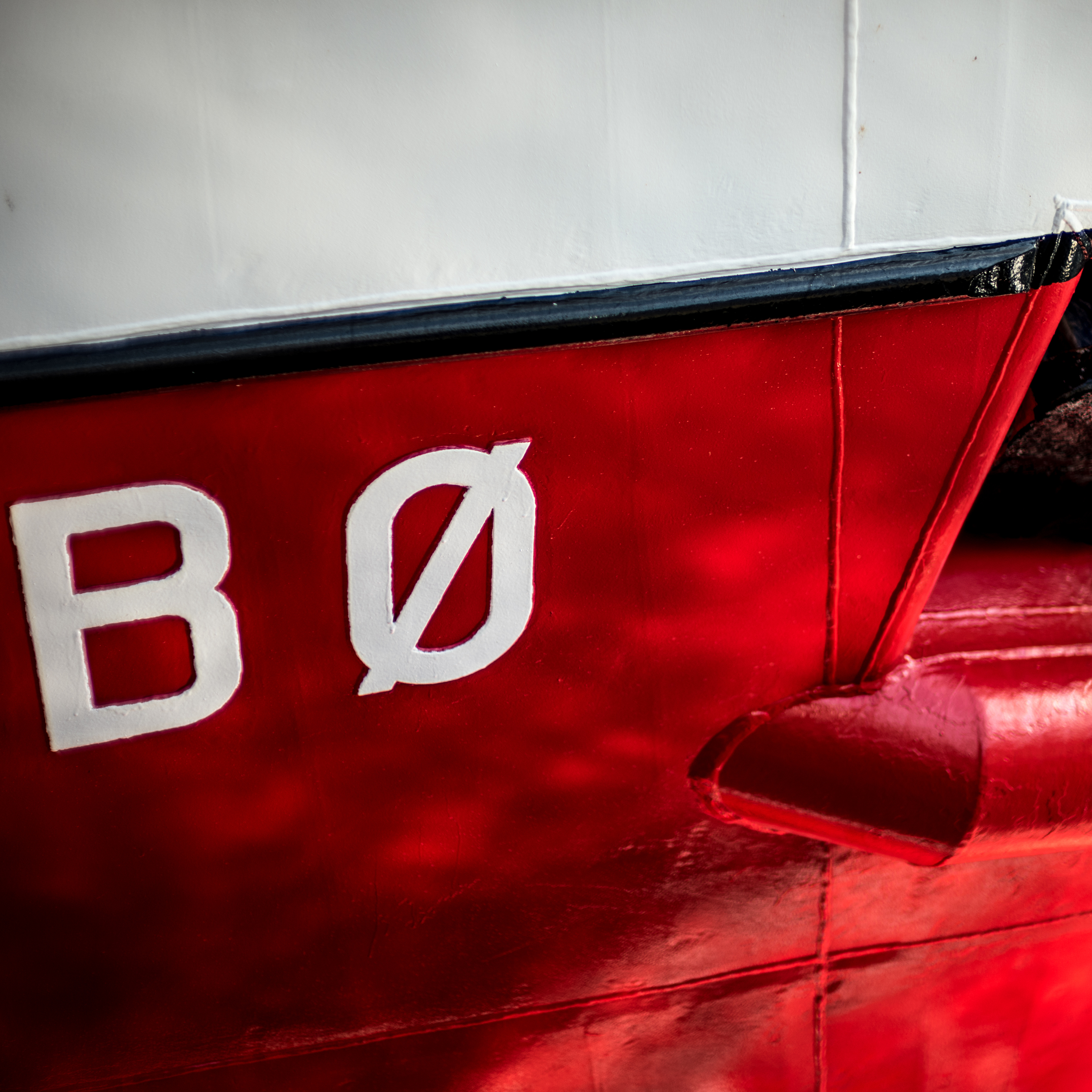 "BO" - part of the bow of a large commercial fishing vessel docked in Alesund.