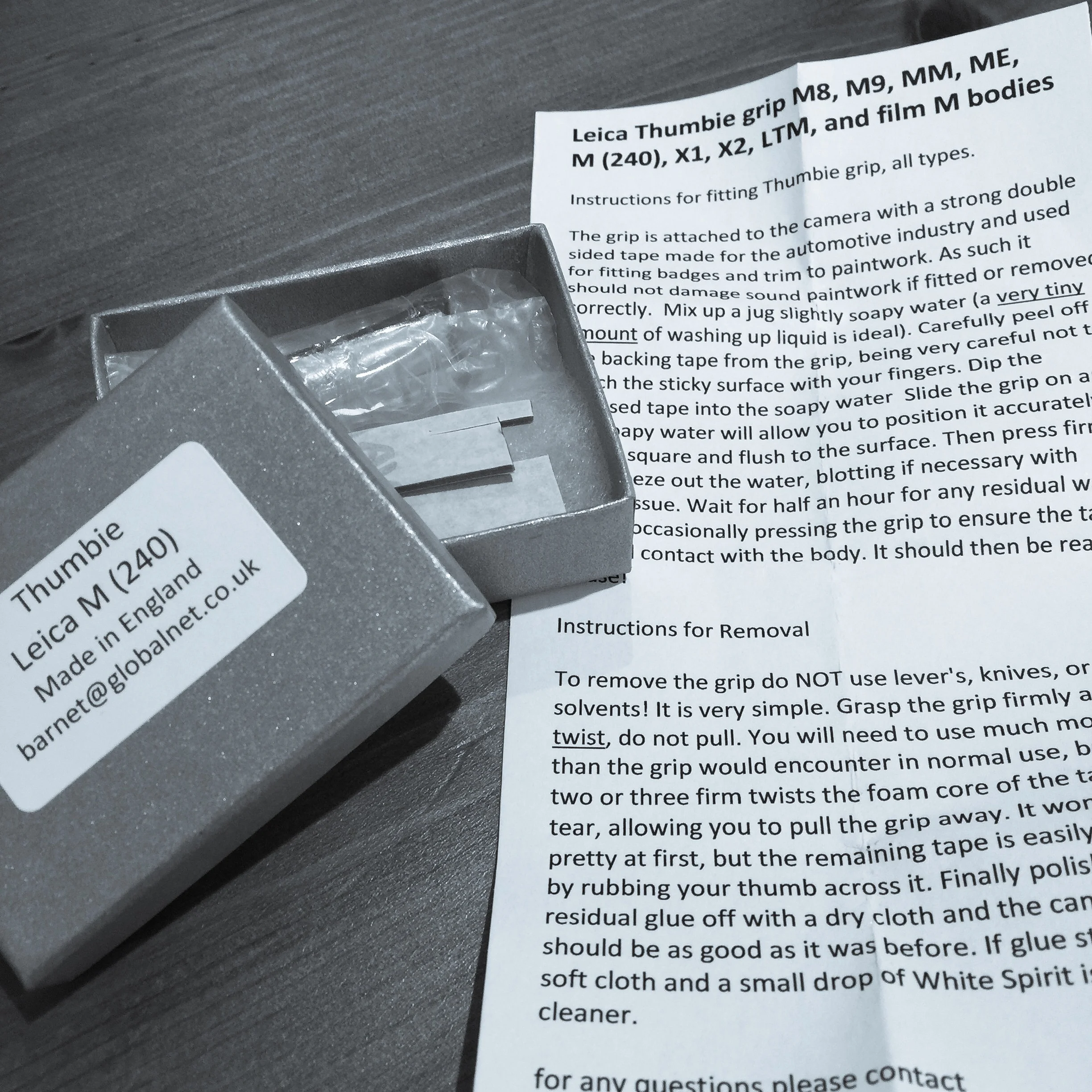 Inside the box is the Thumbie, some spare adhesive strips, and instructions for installing the Thumbie onto a Leica M240 style body