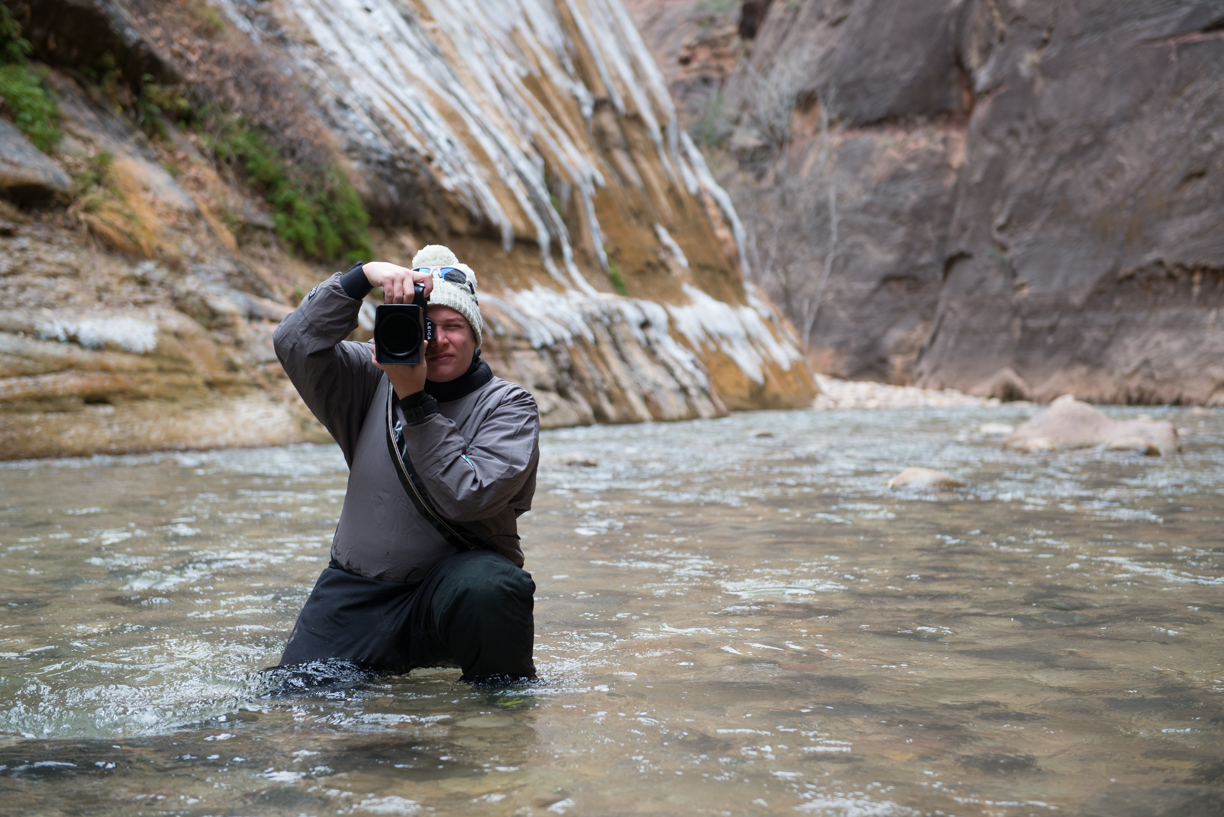 Look ma! No strap as I carry the camera through the famous Virgin River hike in the Narrows. Also, this drysuit isn't the least bit flattering. Photo by Seth Hamel, http://www.zion-photography.com . 