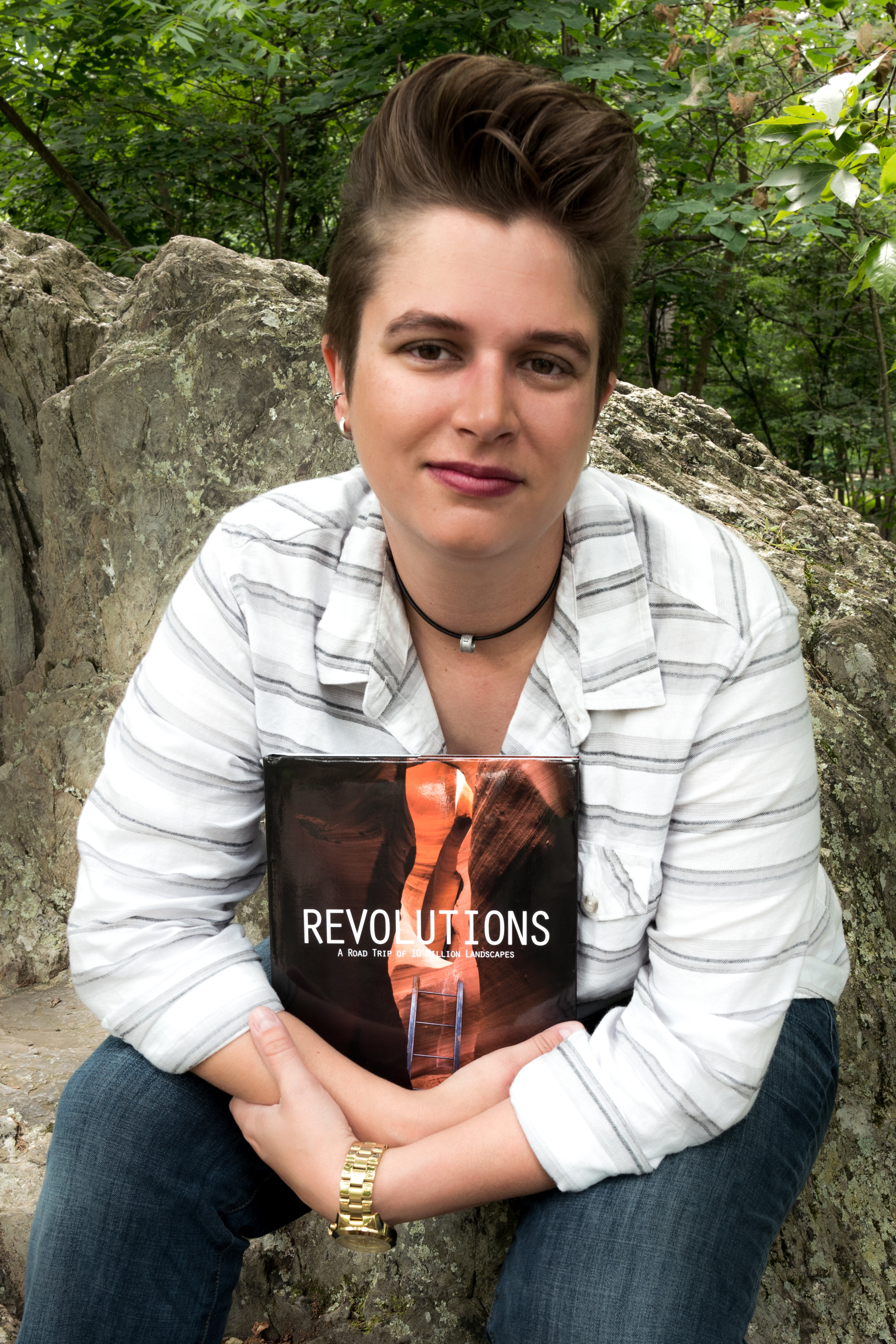 Posing with the final copy of my book, Revolutions.