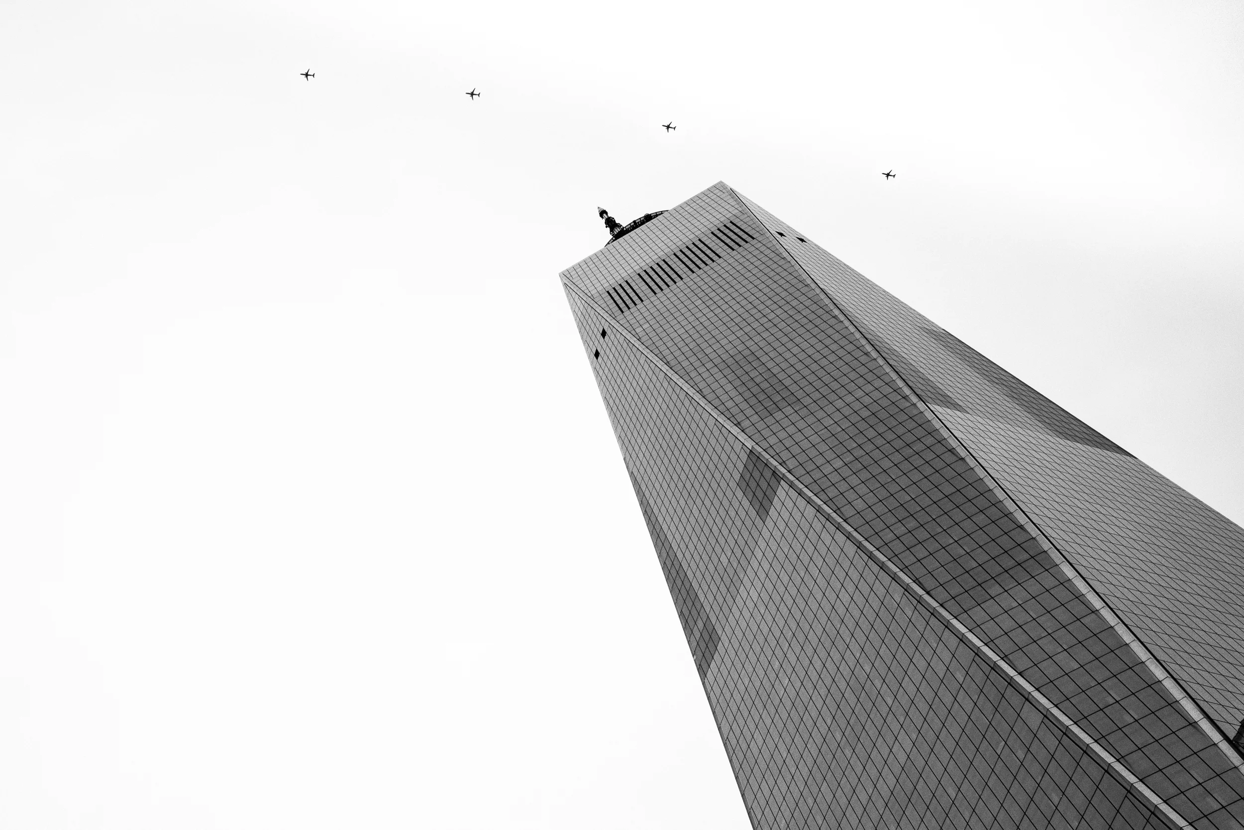 This photograph is very powerful to me. I was standing outside the museum and noticed a jetliner flying over One World Trade. My mind started racing with thoughts.... anywhere else in the world, seeing a plane fly over a building is so routine, that it hardly registers. But here, it seemed raw. This is a view similar to the one thousands saw on 9/11 - but with a very different outcome. I took four images of the plane's track over New York City and combined them in this composite. 