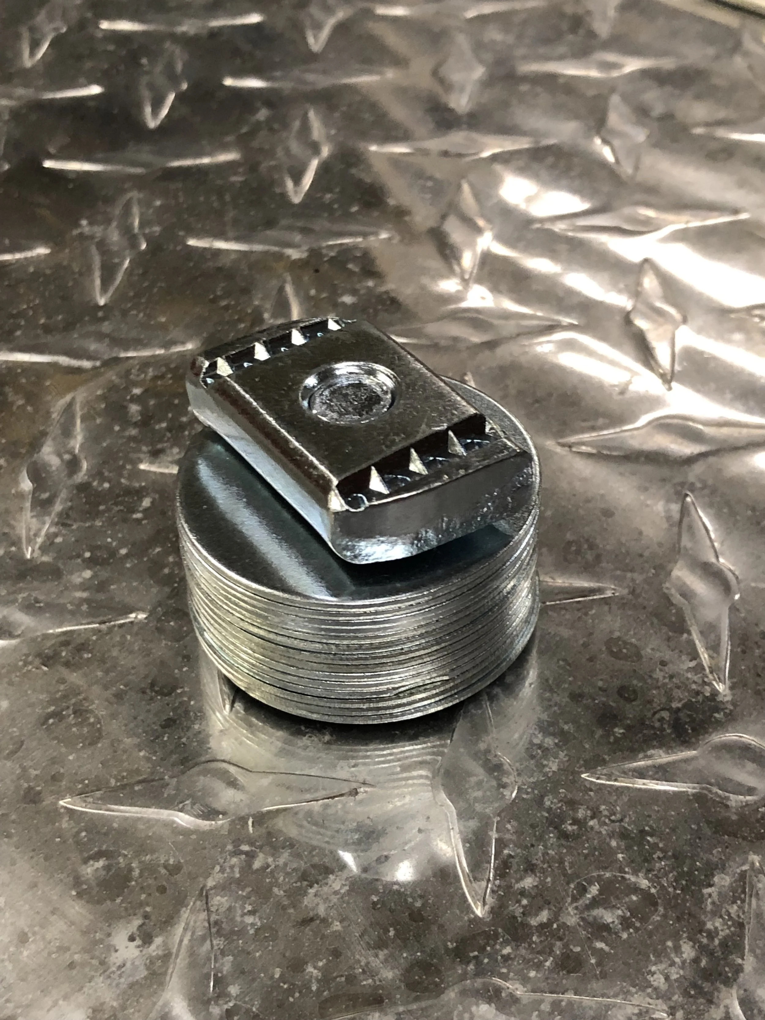 The new hardware threaded through the bottom of the tent.