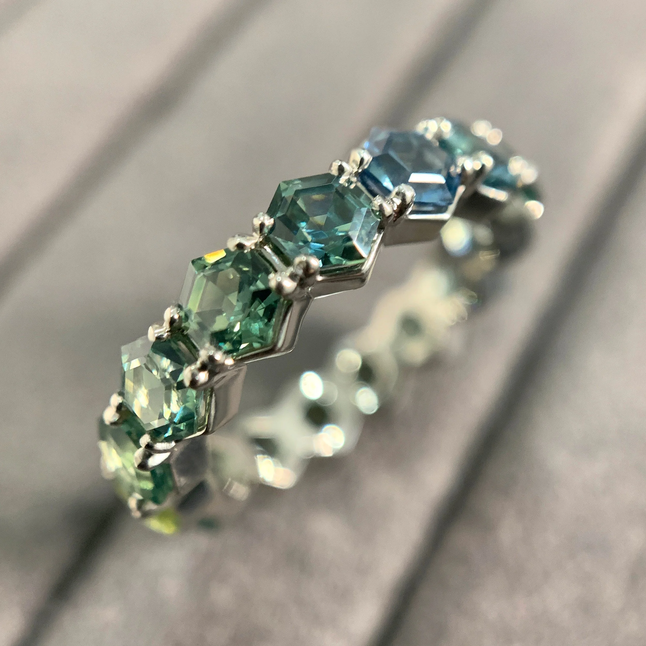 hexagon ombre sapphire eternity ring, hexagon ring, sapphire hexagons, hexagons, sapphires, gold, recycled gold, wedding band, Elliot Gaskin, jewelry, fine jewelry, handmade jewelry, New York City