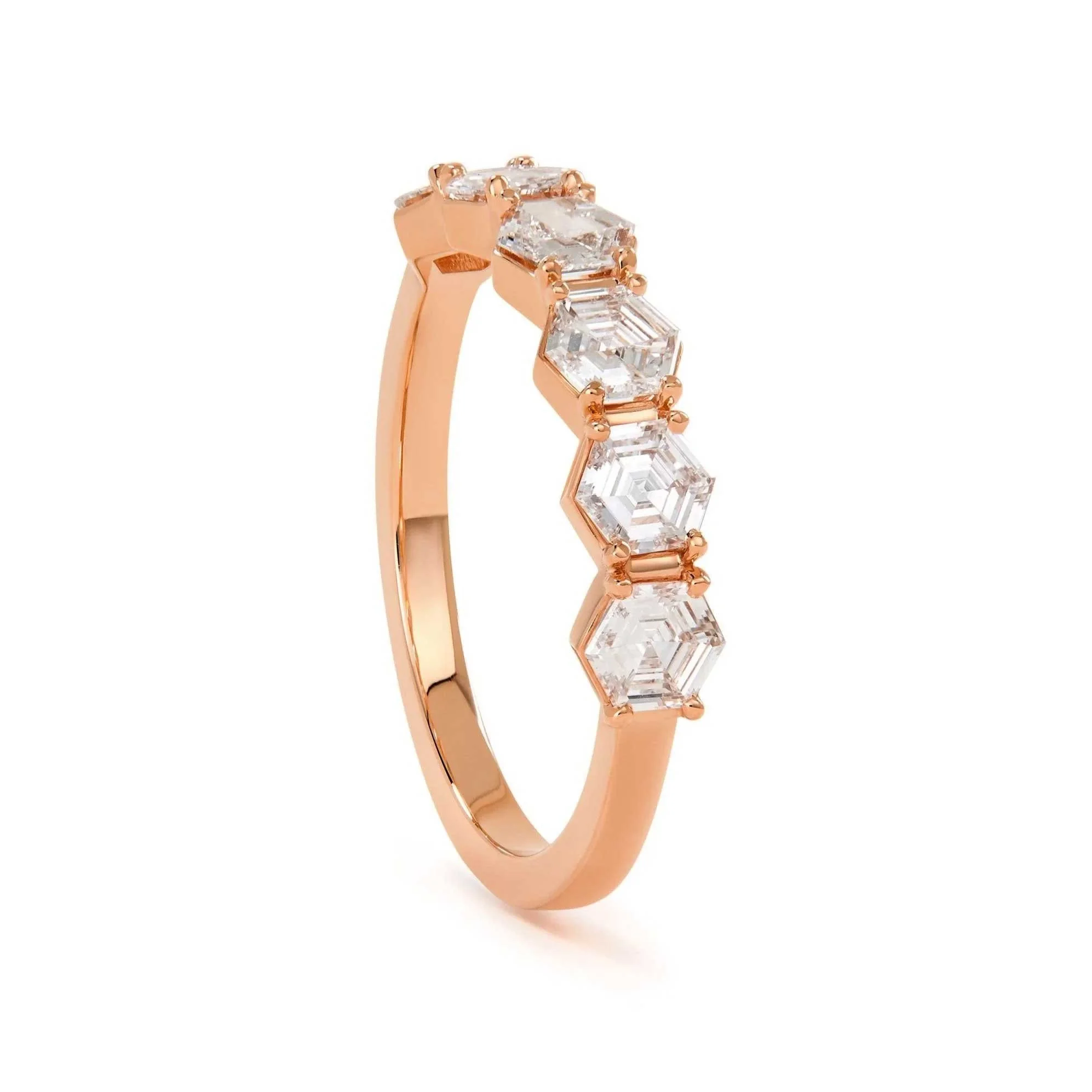 Rose gold half eternity hexagon cut diamond ring by Elliot Gaskin.