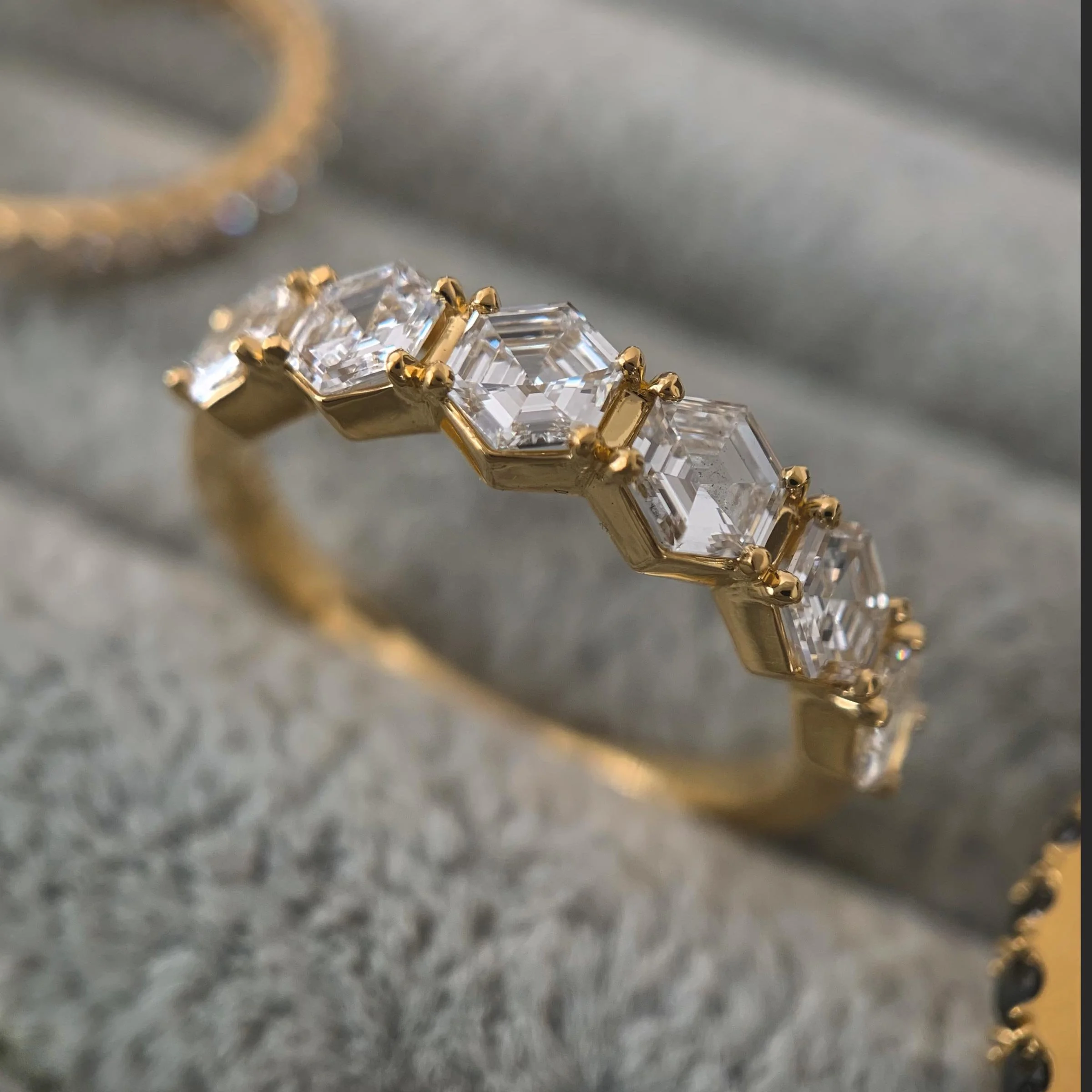 Step-cut hexagon diamond ring in 18 karat gold.