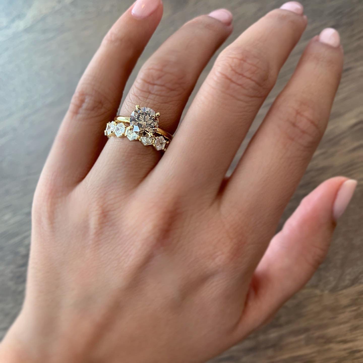 18K yellow gold hexagon diamond eternity wedding band featuring a perfectly matching row of hexagon cut diamonds, handcrafted in NYC.