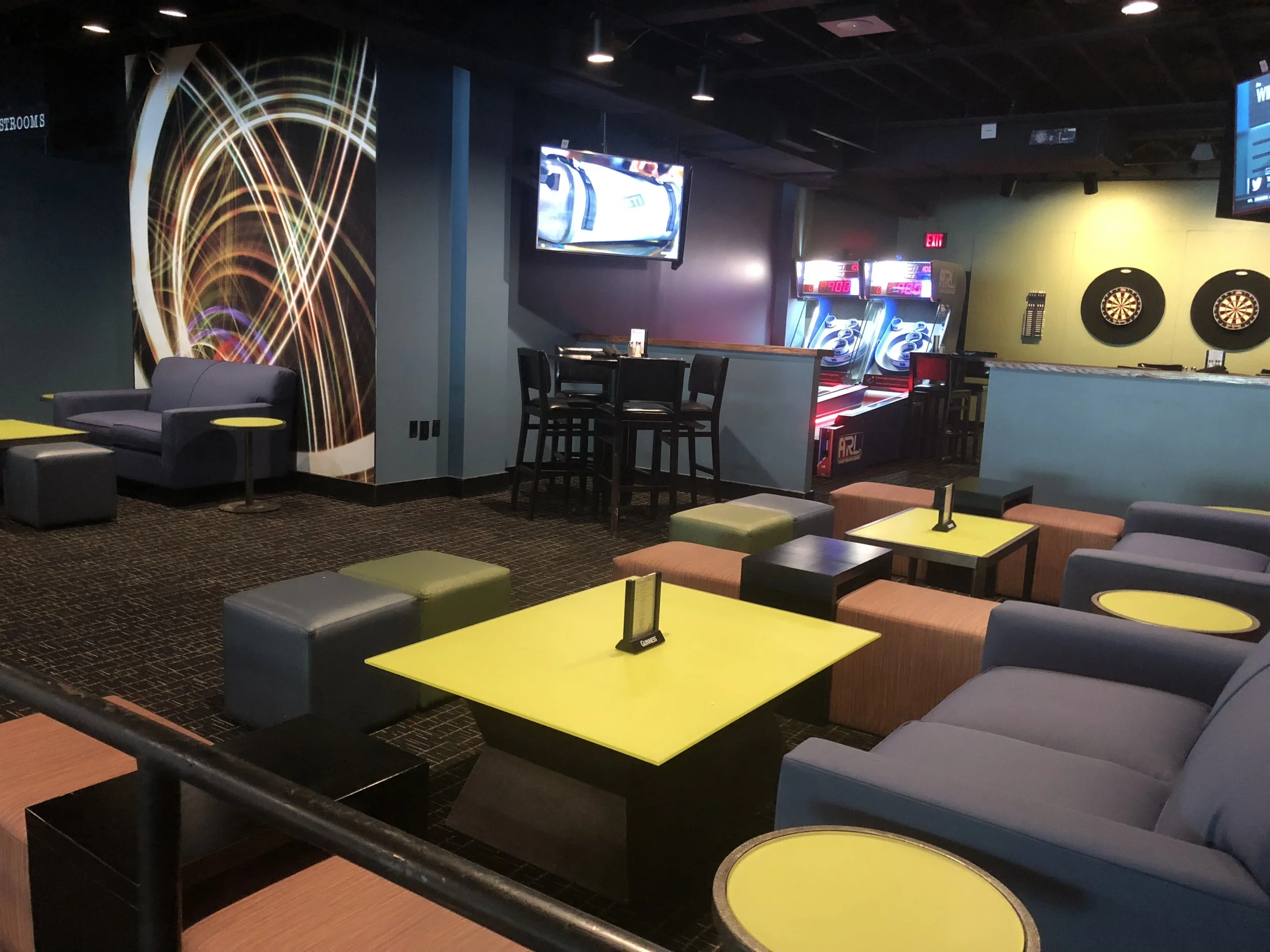 Upper Lounge Several couches, coffee tables, three high top tables, darts, video games & five HDTVs all perched above the action in the main room.