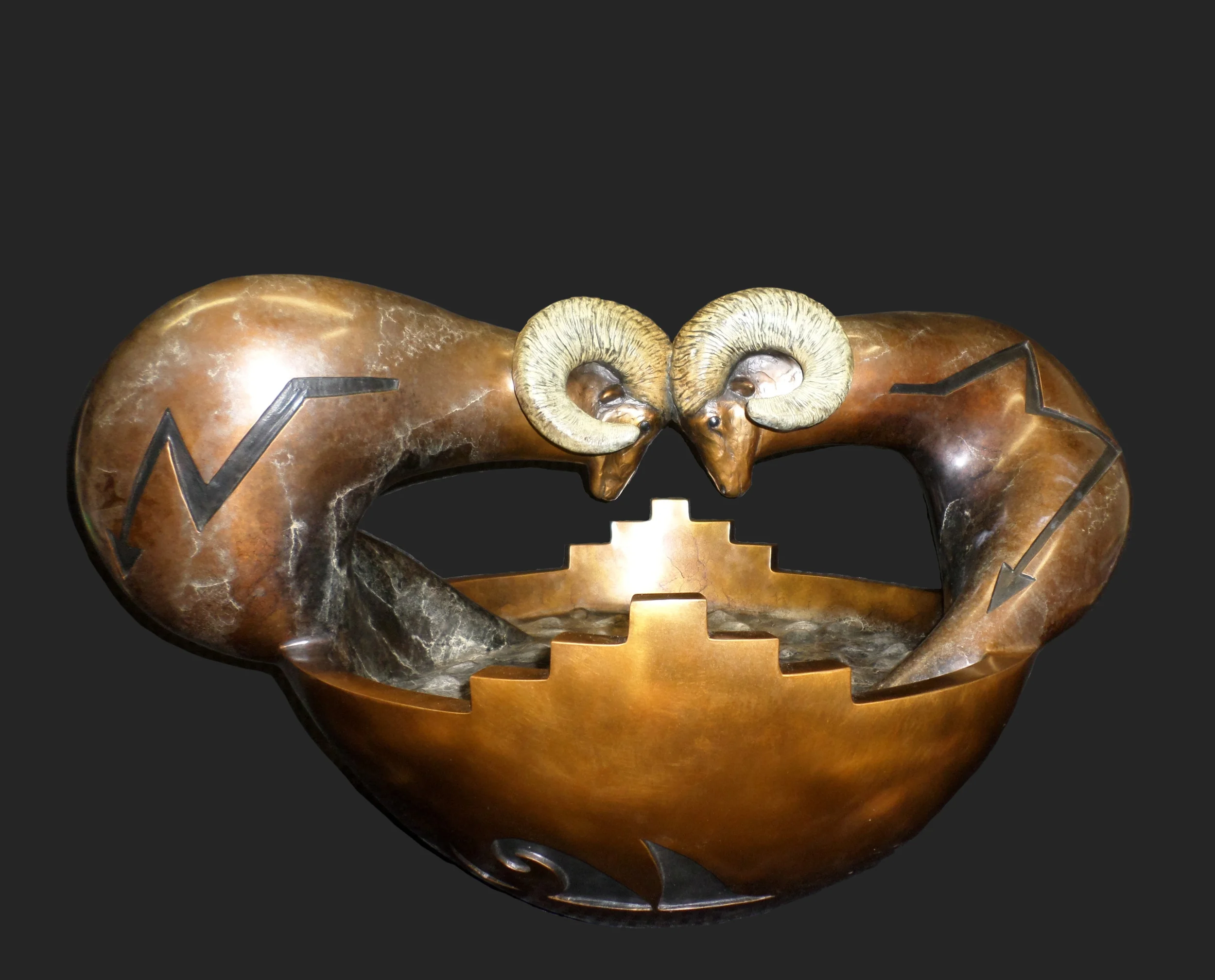 SHARE NO 1/16 AWARDED 1ST PLACE AT 2014 SANTA FE INDIAN MARKET This sculpture came from my memories of a ceremonial Ram Dance. My Experience - Mindfulness and Subconscious recall. Share - The Rams measures 32" in length, 22" in width and 18-1/2" in height. Available No. 3/16 Price: $22,500. Precast Price No. 4/16 $18,500. (12 to 14 weeks Delivery)