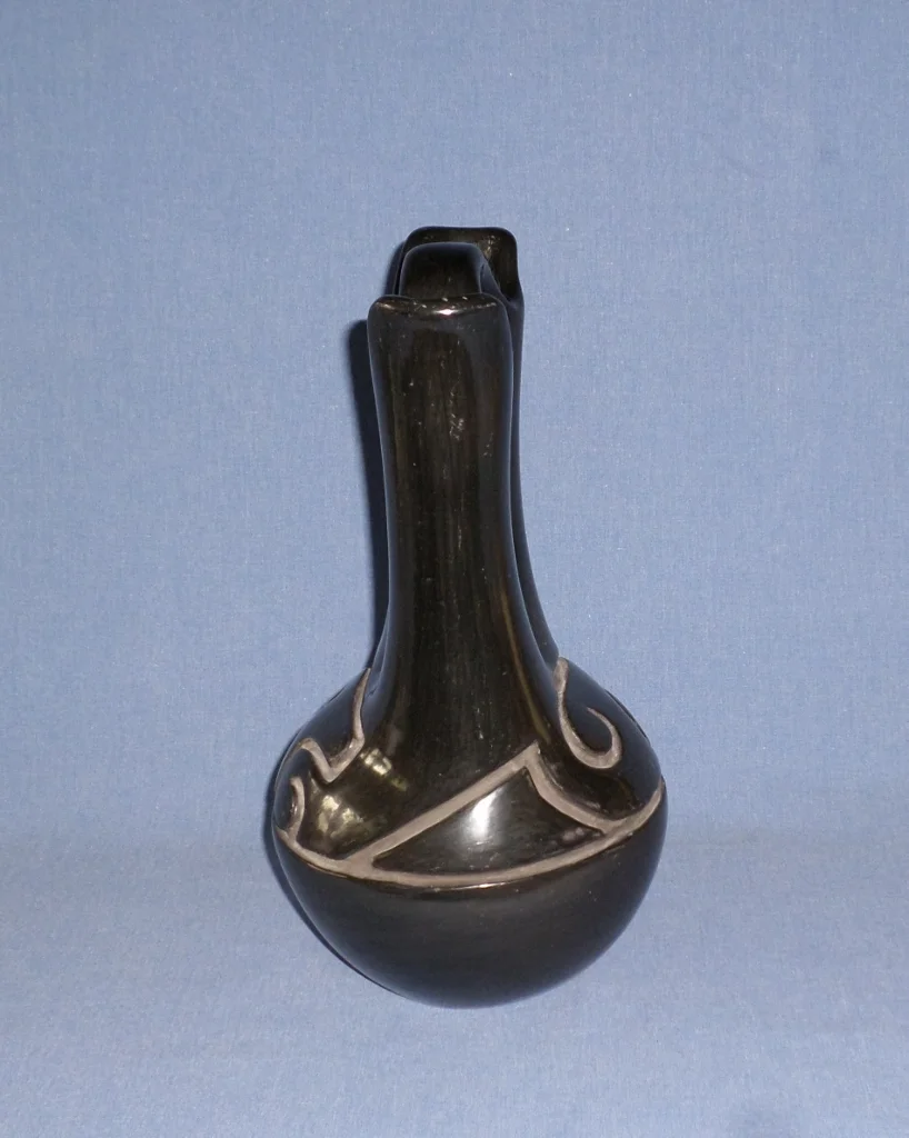 Black Wedding vase with deep carved Nature Designs c.1940 6-1/2" W (across spouts) X 12-1/4" H Price $18,000.