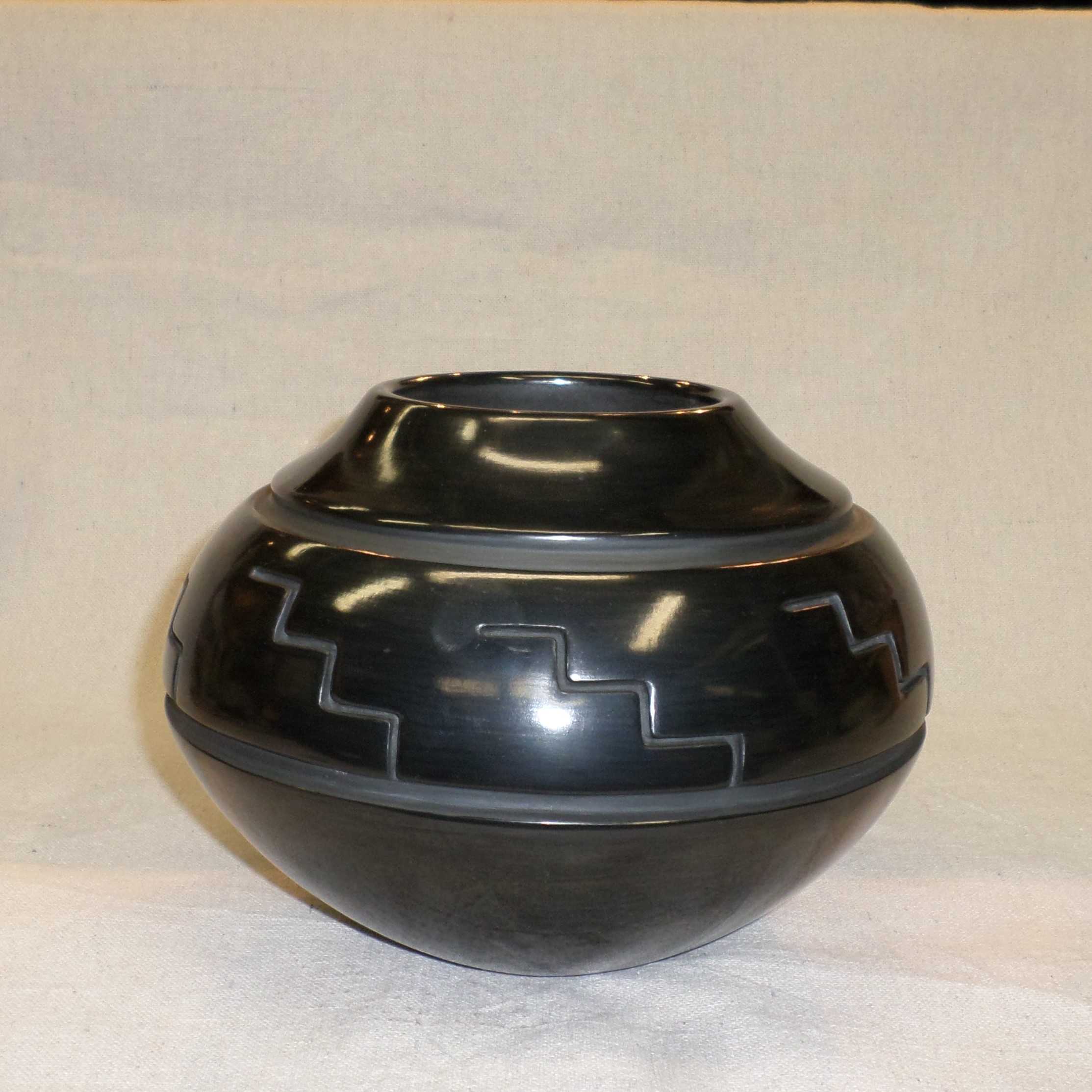 Black carved traditional Jar with Kiva step Design 6" H X 8-1./4" Dia. SOLD