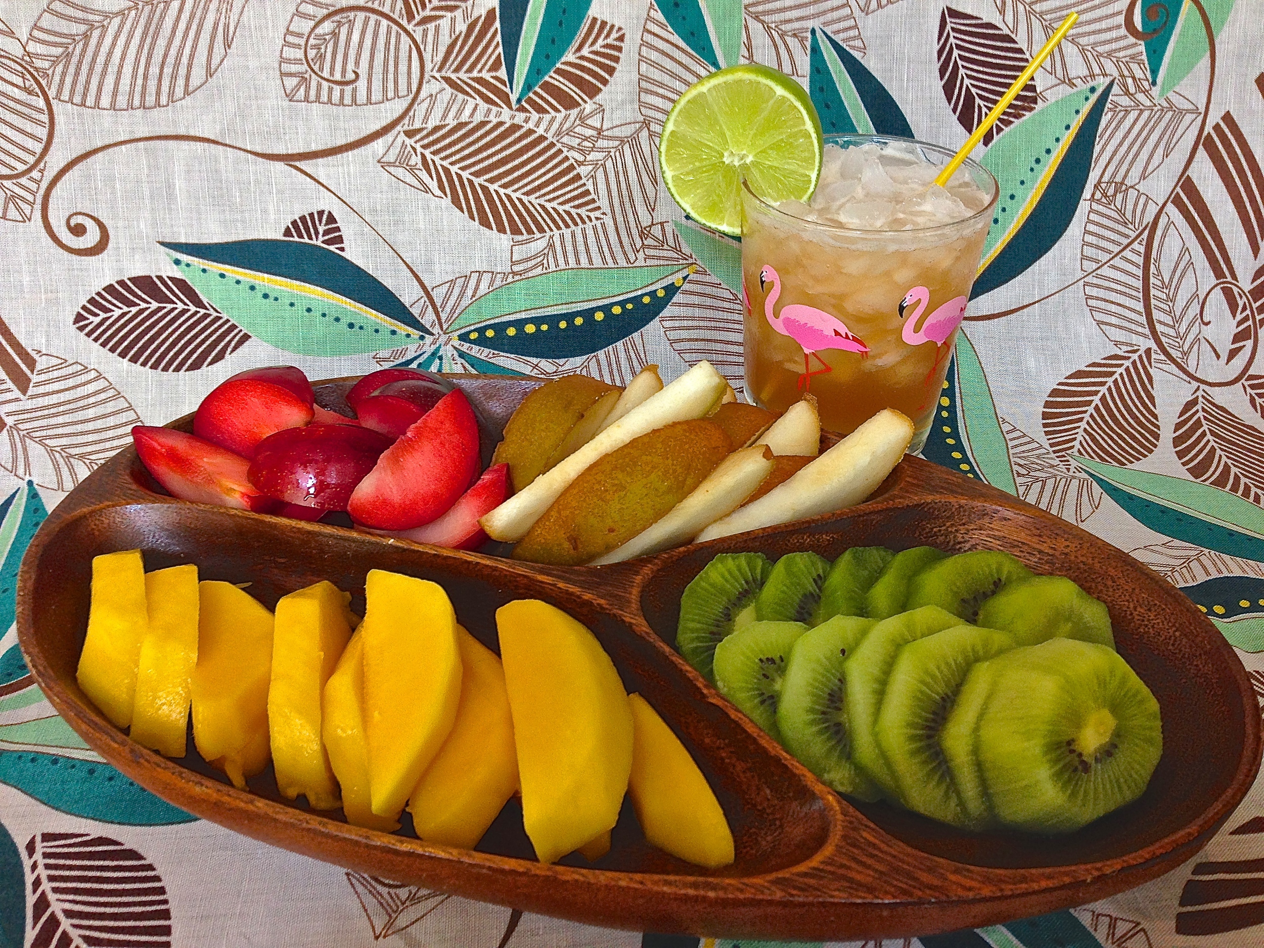 Any colorful mix of fresh fruit can take on a tropical look when you present it simple and bit size. 
