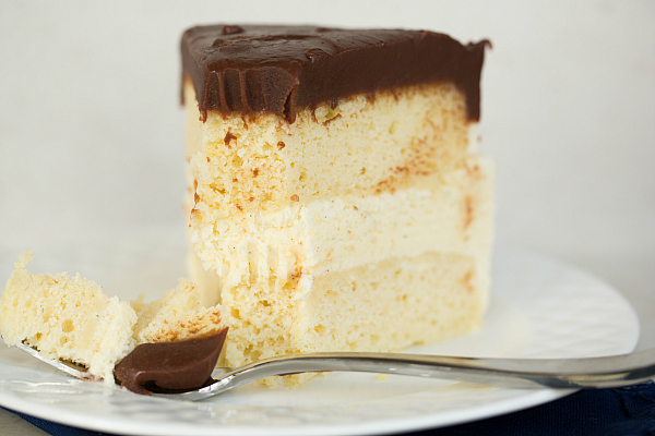 Making your own boozy ice cream cake really couldn't be easier. And you can freeze it ahead of time and just pull it out before your serve. Our original recipe uses vanilla whipped topping for the frosting, but we also tried adding chocolate powder and vanilla to the whipped topping for more fun and flavor. 