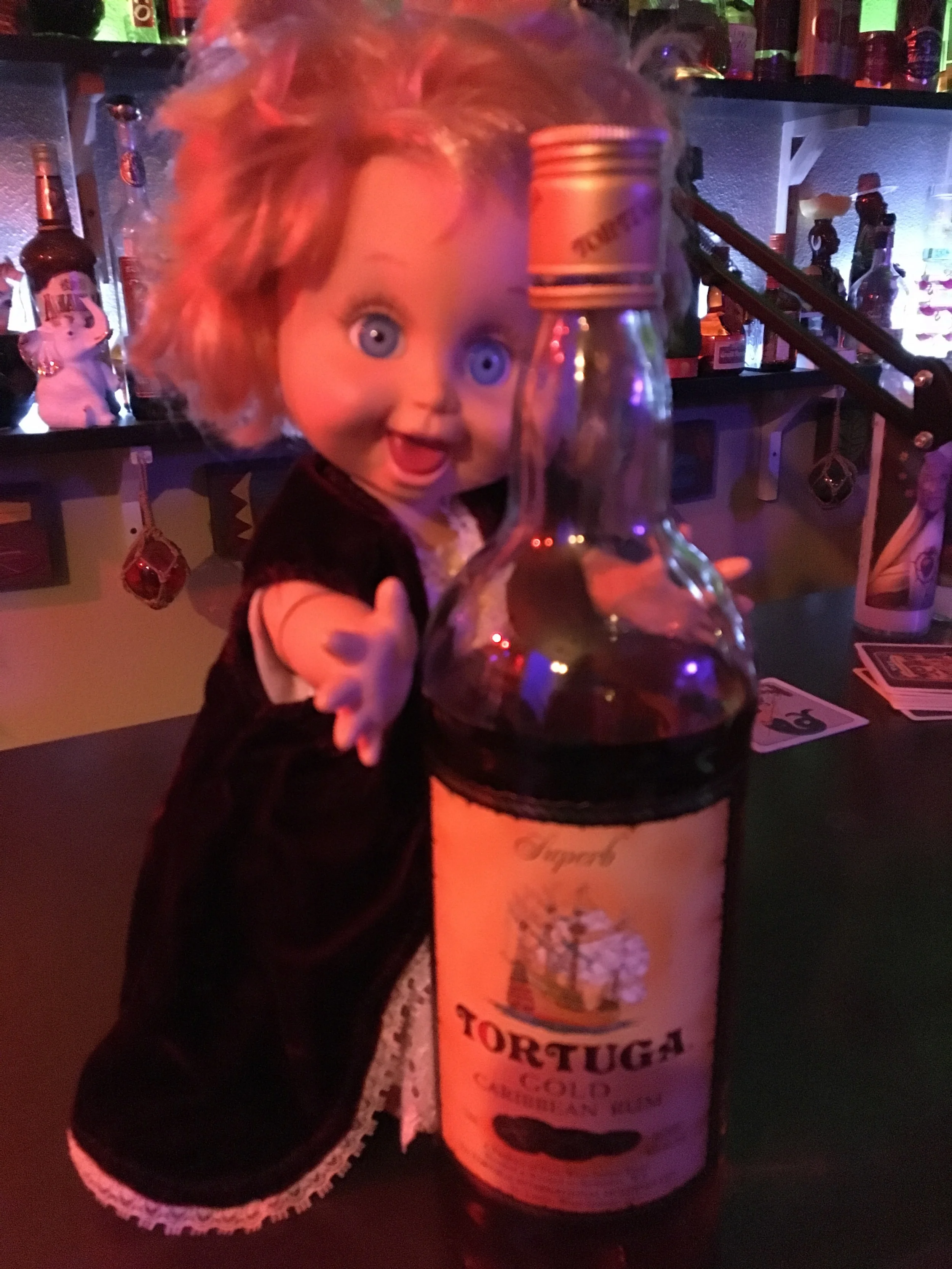 One of the greatest thing about a gag gift exchange is receiving creepy items like this one. This crazy eyed baby doll was just sitting around for decades until wrapped up and given to Sunshine to go with all his rum. 