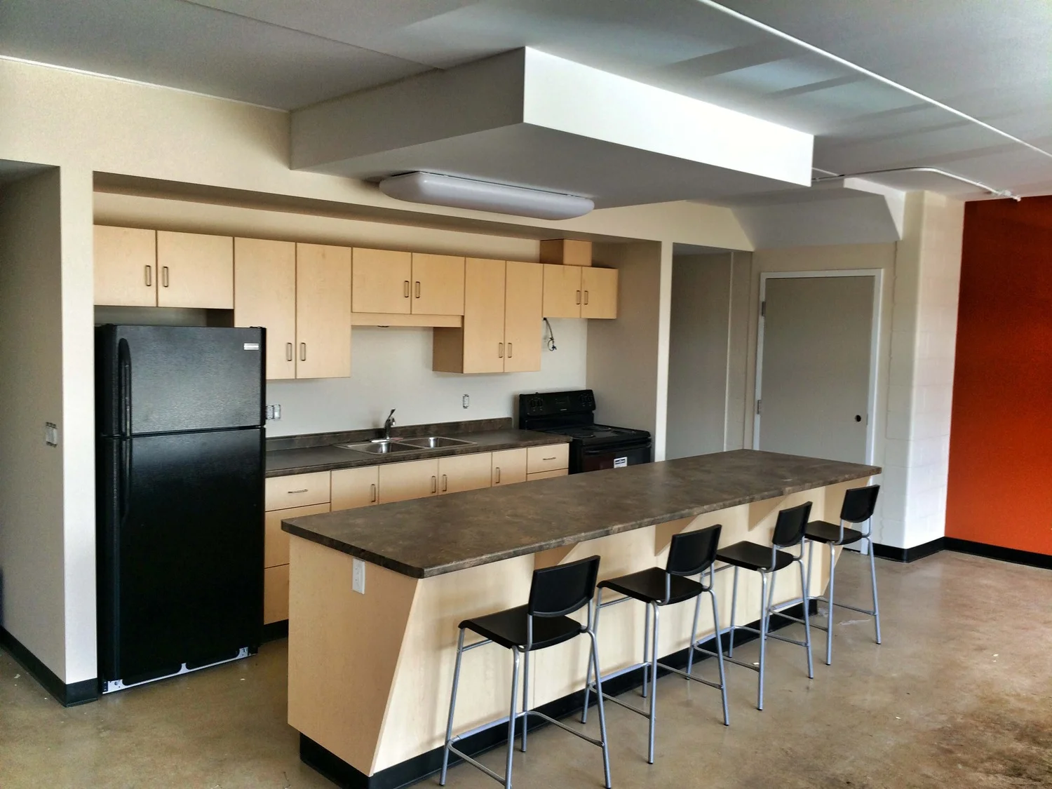 Spacious, open-concept kitchen and living room. 