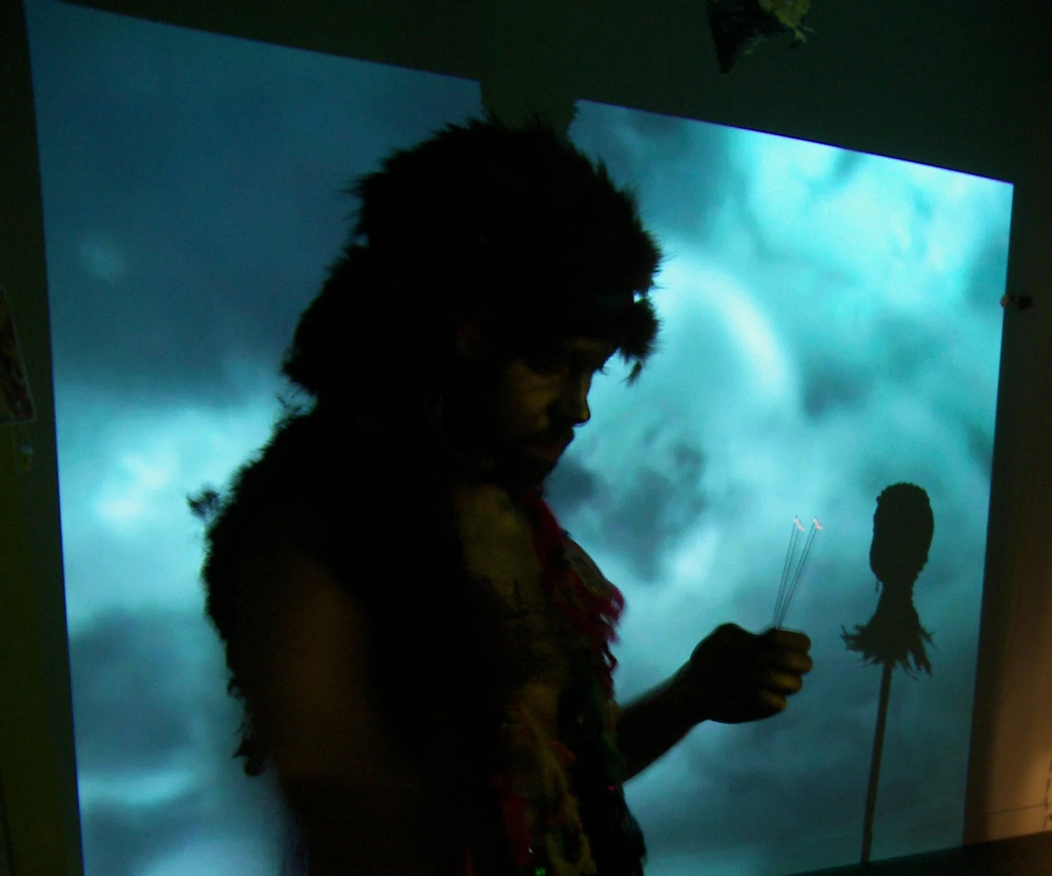  Say Nothing Real Loudly Installation, performance 2009 2 hours At the opening of the exhibition the ordained actor anointed the eyelids of the kneeling devotee with blue paint so they could "see". Any member of the viewing public could worship. "That's What You Get" by Peter Paul and Mary played throughout the gallery on a loop. A video projection slowly moves the space from day to night.