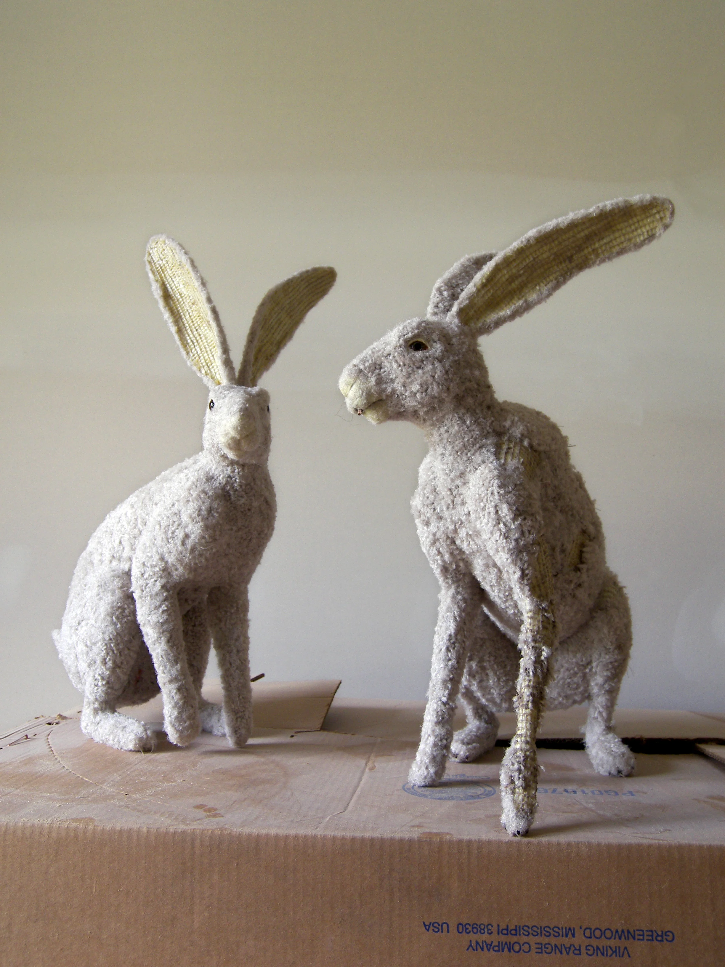   Carpet Hares In Universal Beige   Installation &nbsp; &nbsp; &nbsp; &nbsp; 2007  4' x 4' x 4'  Cardboard boxes, carpet, foam, resin, latex rubber, acrylic paint, varnish. 