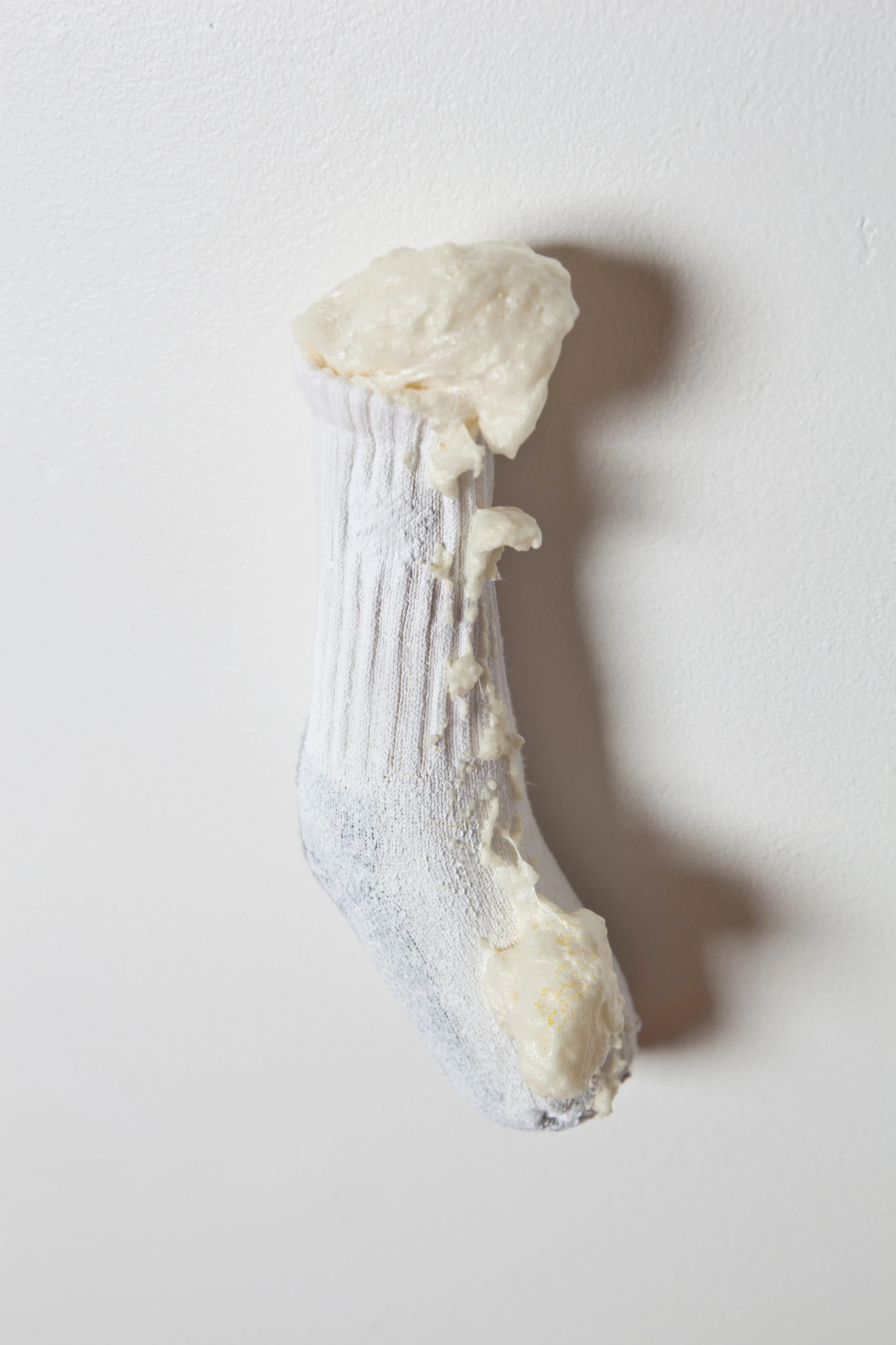 Sock Hop Installation detail 2013 8' x 6' x 3' Socks, cast plaster, spray foam, rubber, latex paint, glitter, sand. Things as thoughts...