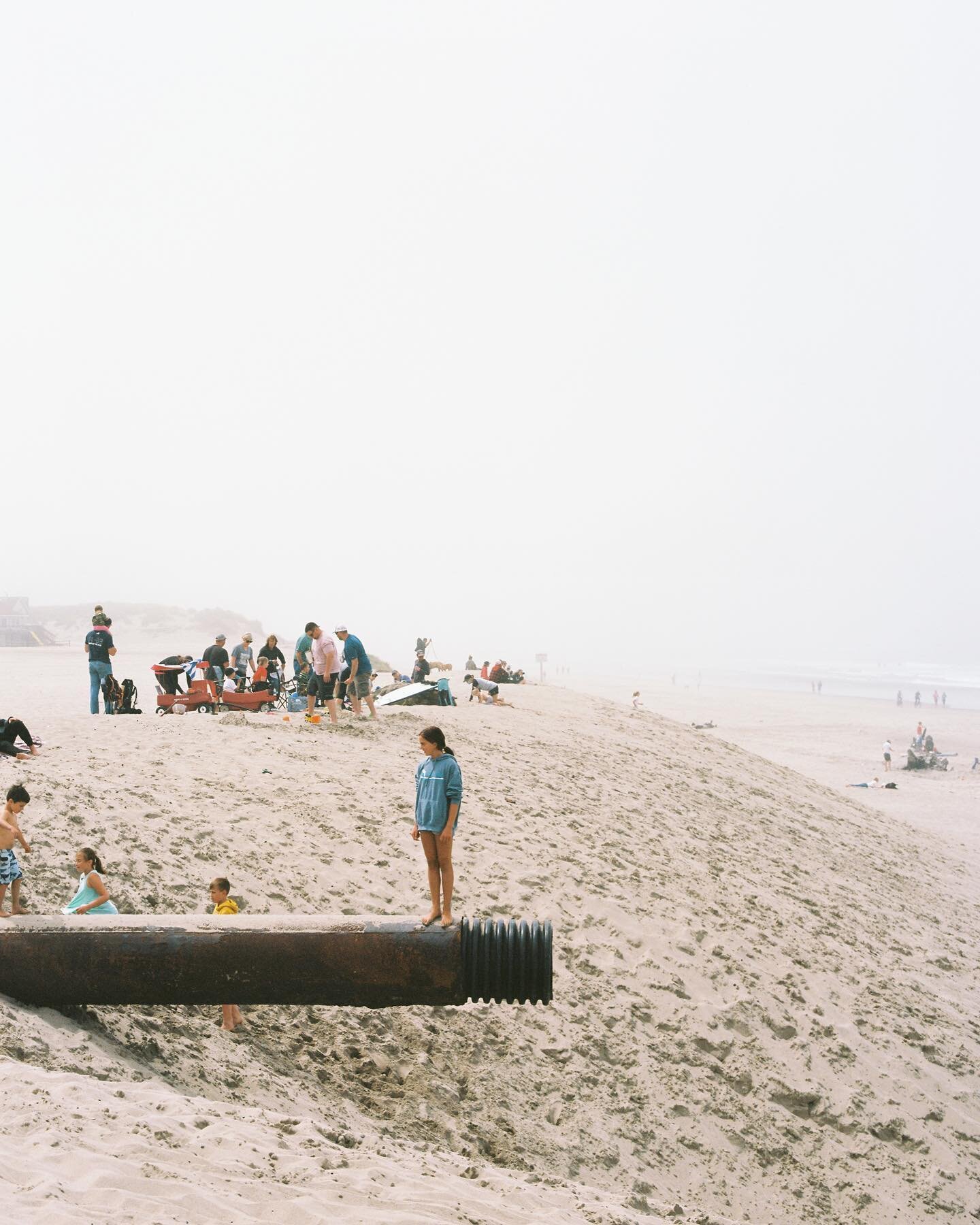 The fog moves and you realize there are in fact others on the beach with you.