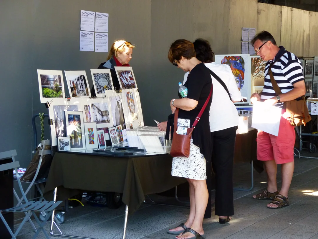 Artists and food vendors have small stalls to exhibit and sell their wares. Source: Aseem Inam.