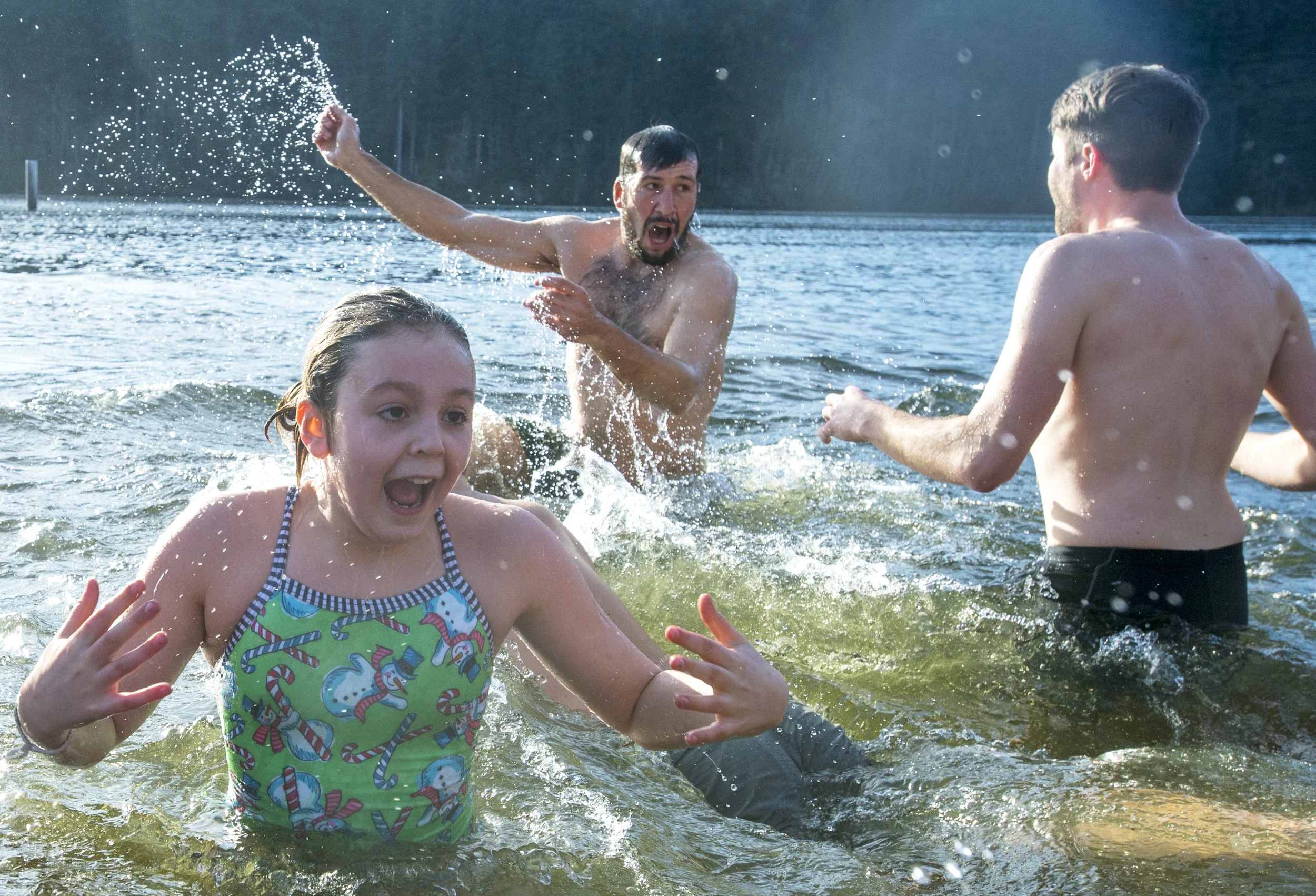  People rush back to shore after jumping into Lake Padden at the 2014 Padden Polar Dip on Thursday, Jan. 1, in Bellingham, Wash.&nbsp; 