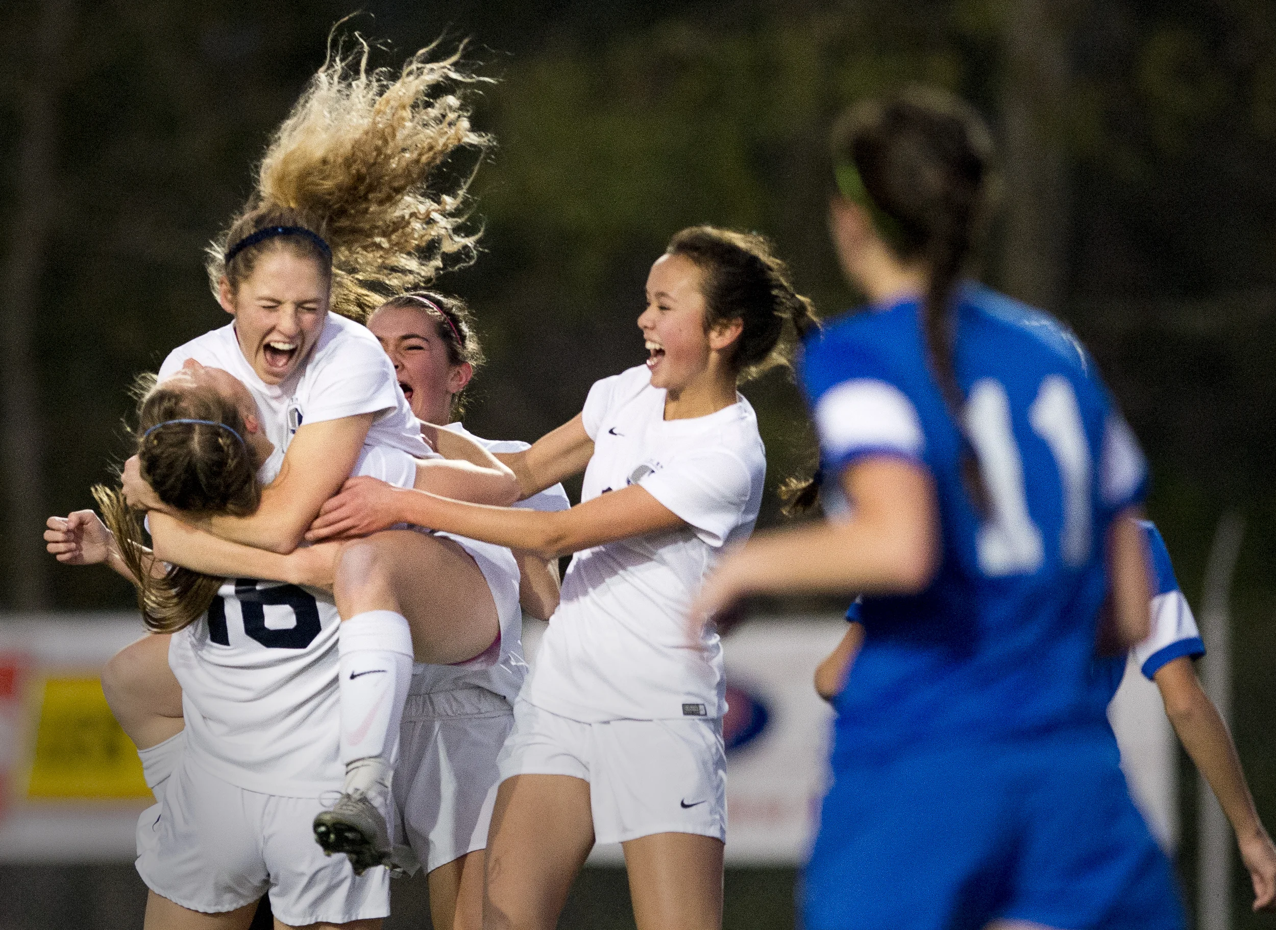  Squalicum’s Kim Hazlett jumps into the arms of Kim Dorr after scoring a goal during the WIAA 2A State Girls’ Soccer Tournament championship game on Nov. 21, 2015, in Shoreline, Wash. 