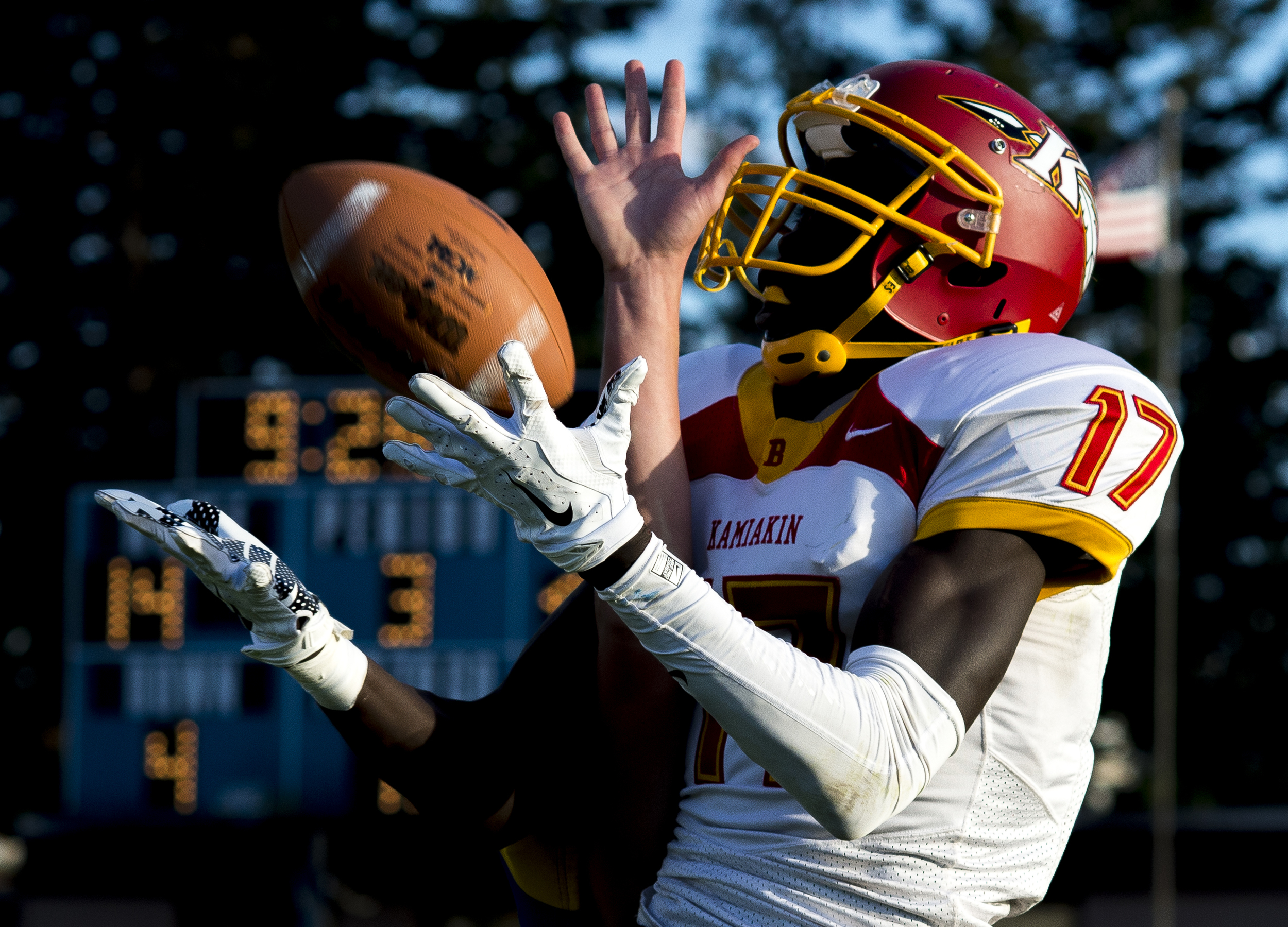  Ferndale's James Hinson knocks the ball away from Kamiakin's Mugtaba Kori to prevent a touchdown on Saturday, Sept. 5, at Ferndale High School.&nbsp; 