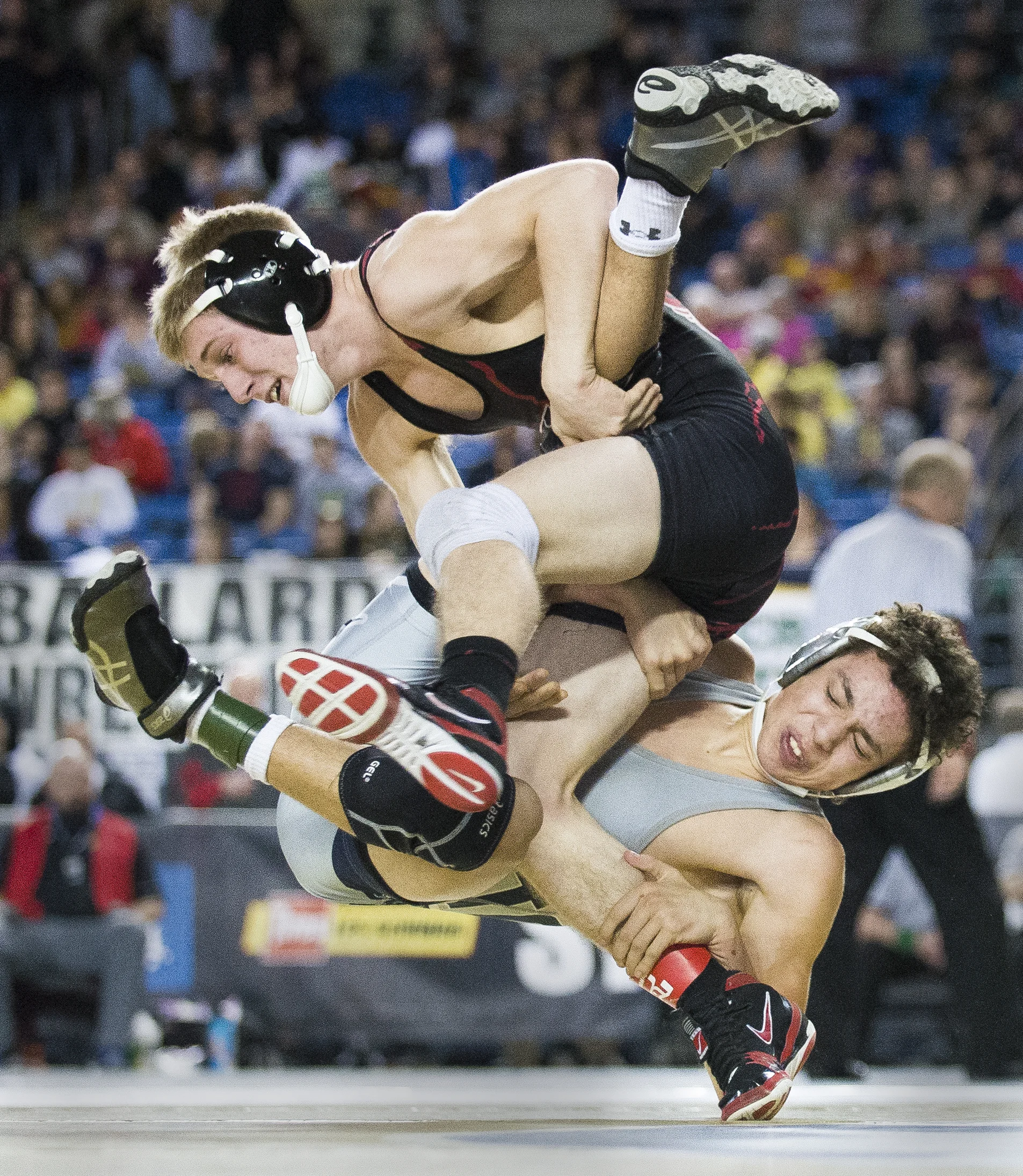  Squalicum's Jase Cooper wrestles Yelm's Gavin Stewart for fifth place in the 3A 113-pound bracket at Mat Classic XXIX on Saturday, Feb. 18, at the Tacoma Dome. 