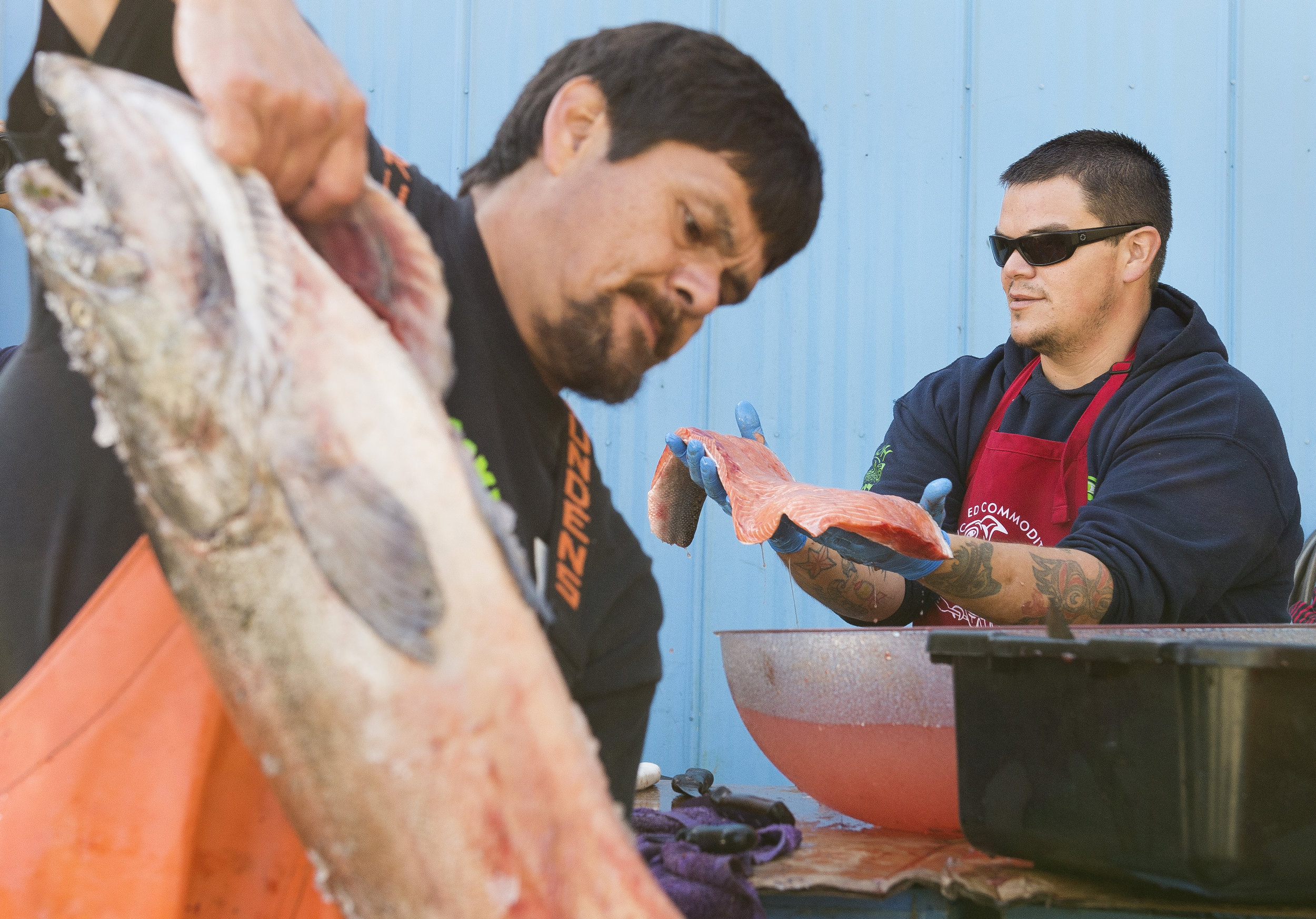  Tyrone Solomon, left, and Joe Pantalia prepare salmon to be sent to the Standing Rock Sioux Tribe in support of their protest against the Dakota Access Pipeline on Wednesday, Sept. 28, at the Lummi Nation Commodity Foods building. The salmon was don