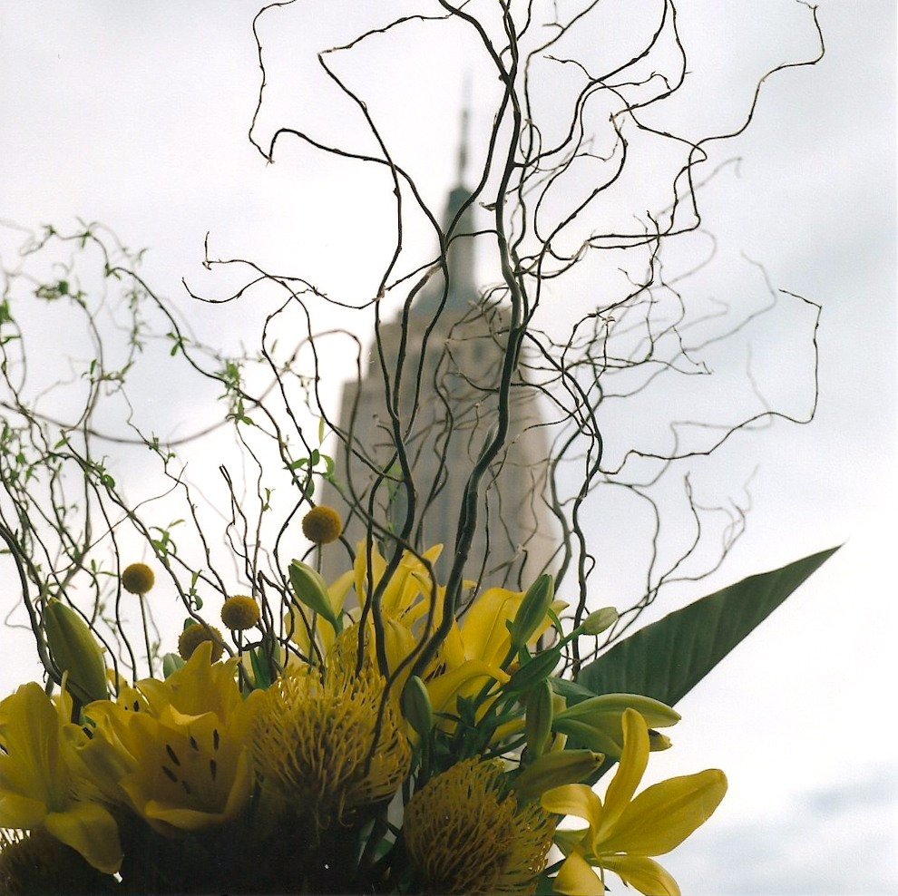 The floral arrangements at Sandy's wedding and the Empire State Building behind