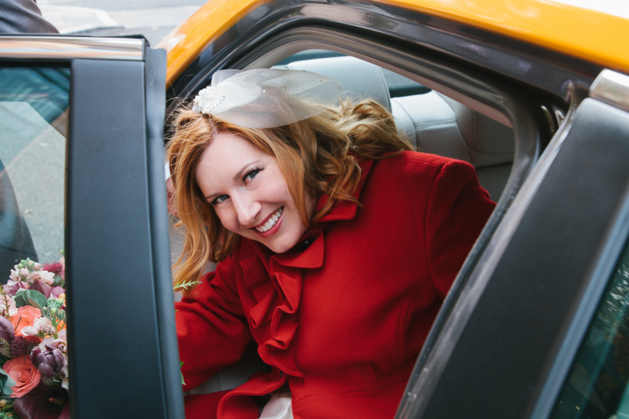 The beautiful bride getting into the taxi to head to the ceremony!