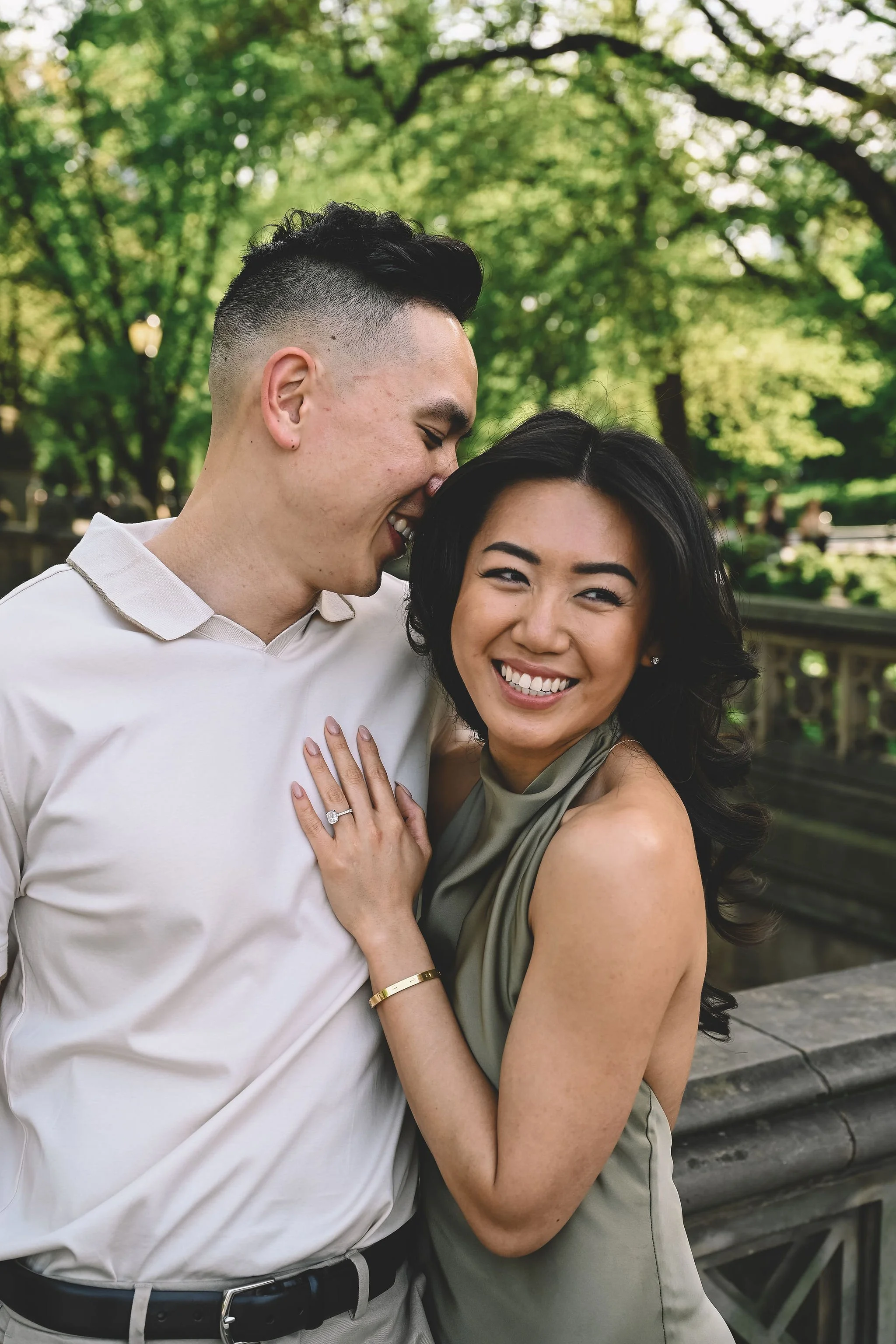 Central Park engagement session featuring a couple embracing near Bethesda Terrace, captured in a timeless, light-filled style by NYC engagement photographer Robert Carlo.