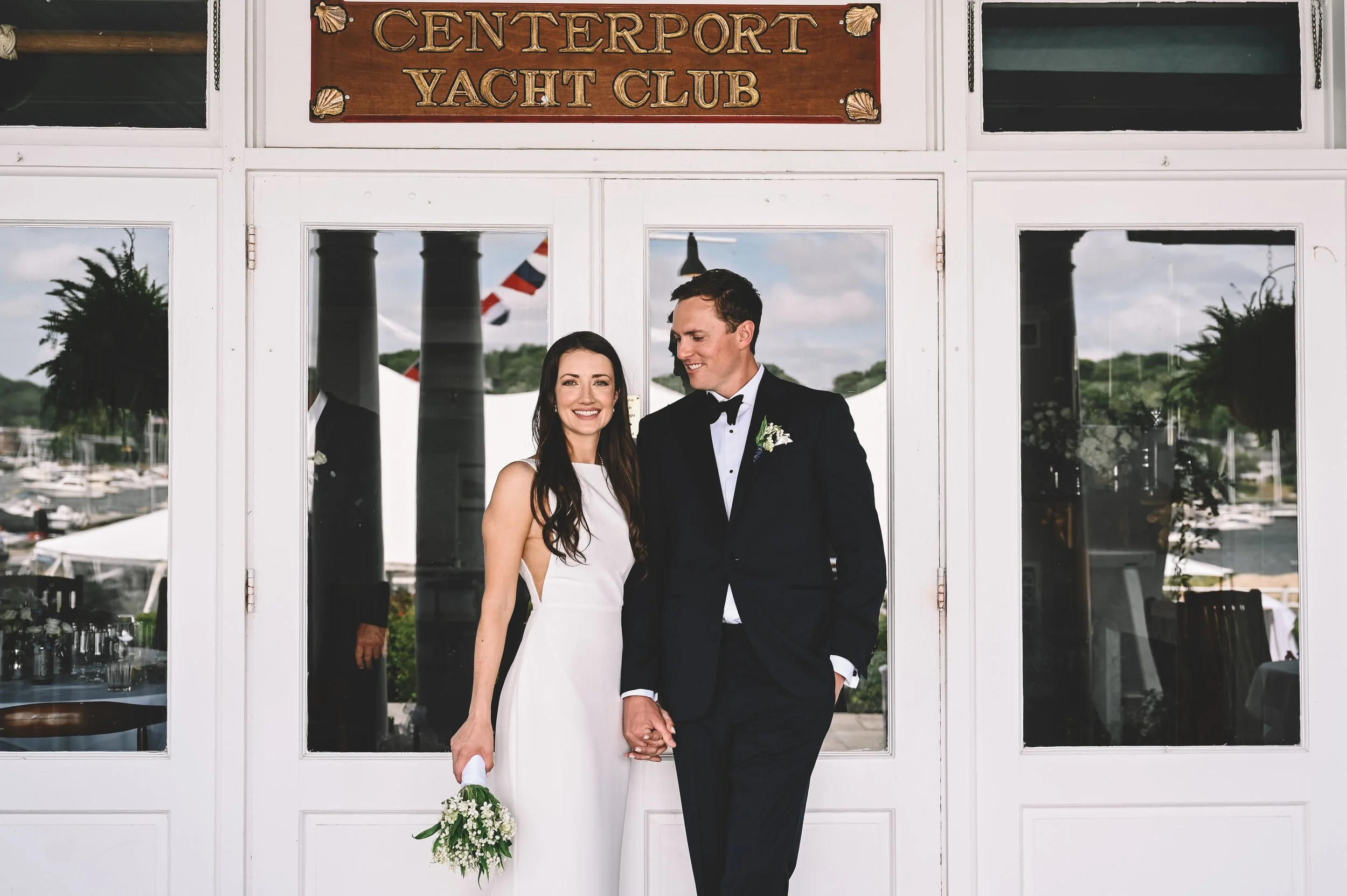 Long Island wedding photographer capturing bride and groom at Centerport Yacht Club, documenting elegant waterfront wedding on North Shore with coastal views.